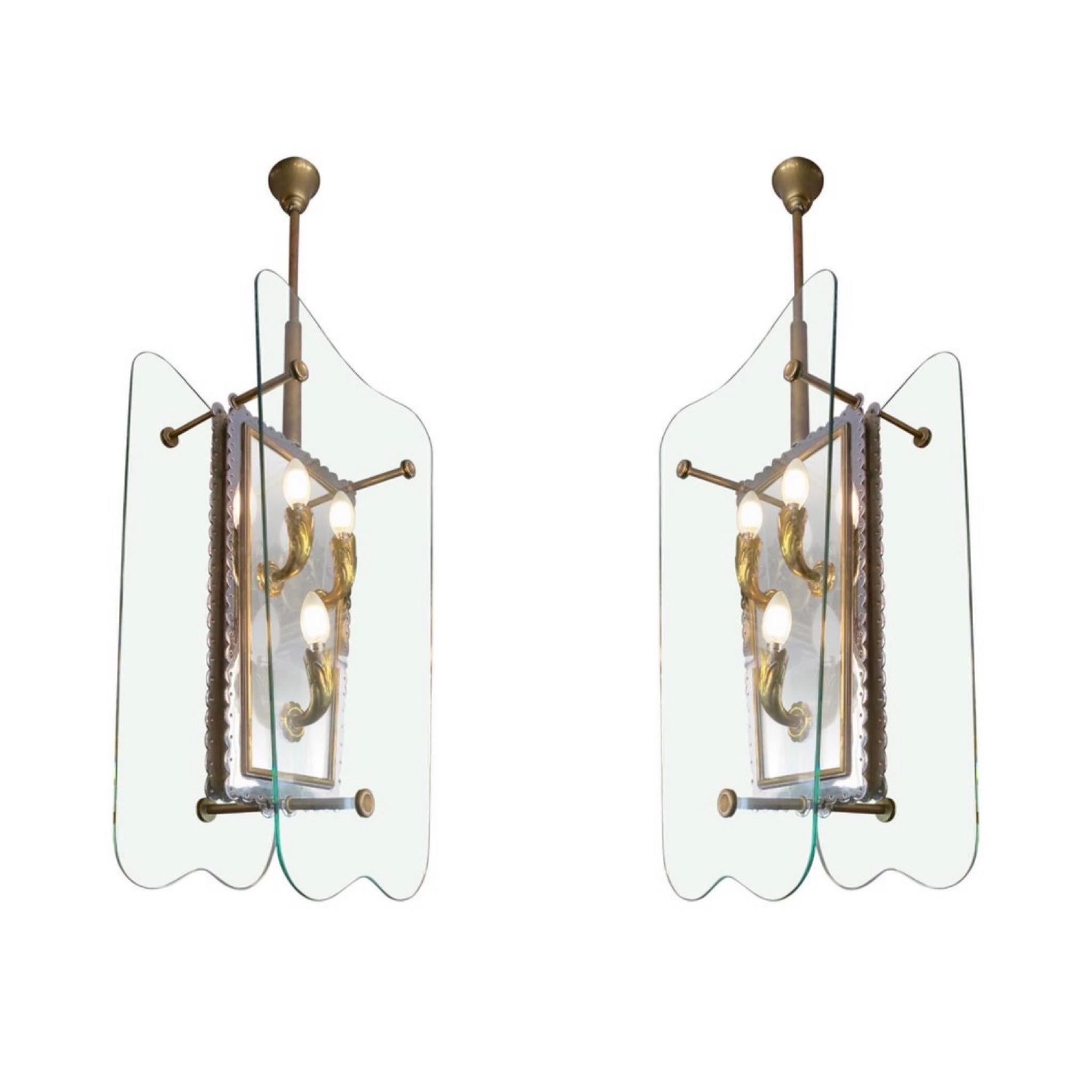 A very large pair of quality Italian lanterns, with six brass light fittings each, supported on a nickel plate with decorative circular border and inner brass slip. The shield shaped glass shades held in place by brass arms and capped with circular