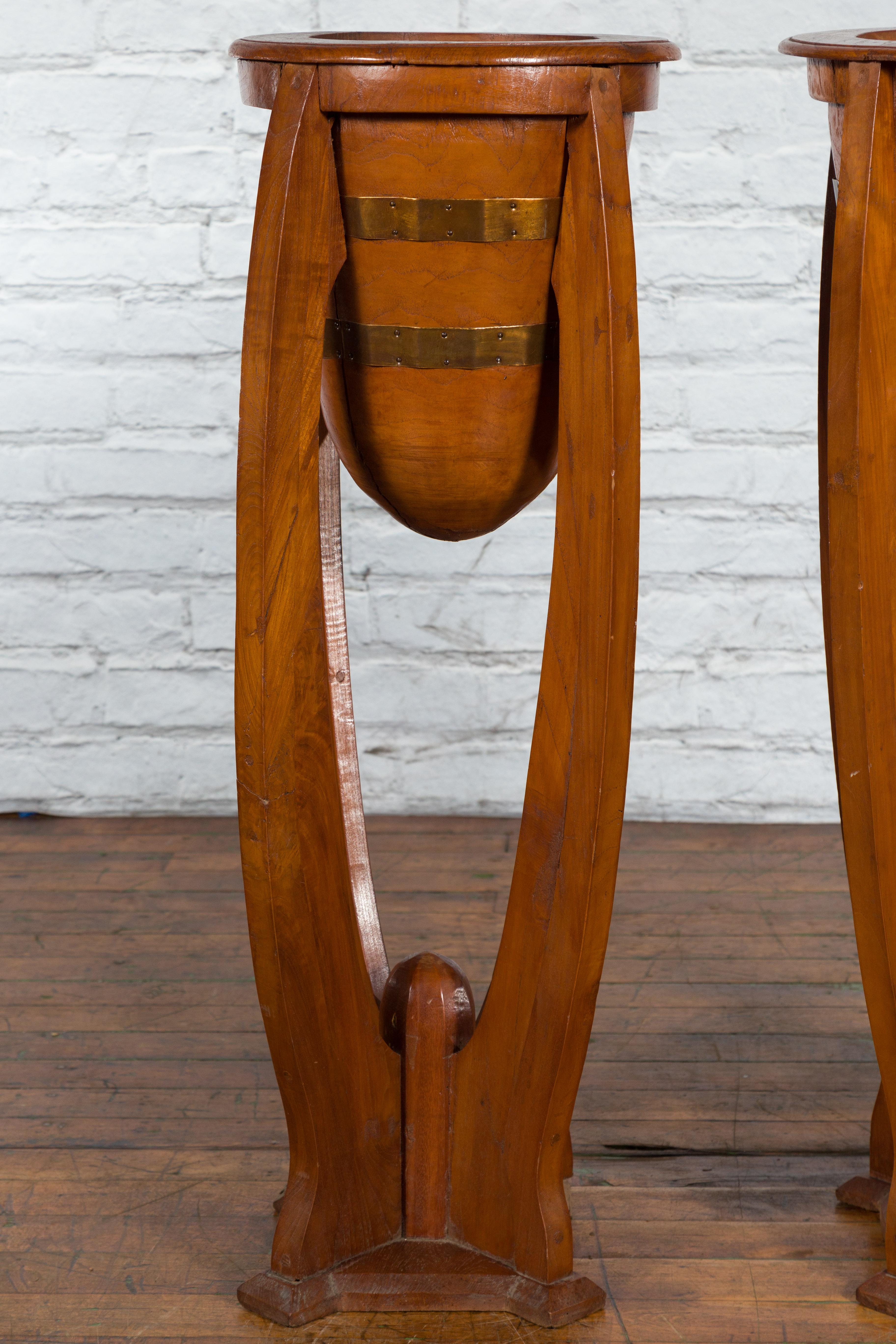 Large Pair of Javanese Art Deco Style Teak Wood Plant Stands with Brass Braces In Good Condition For Sale In Yonkers, NY