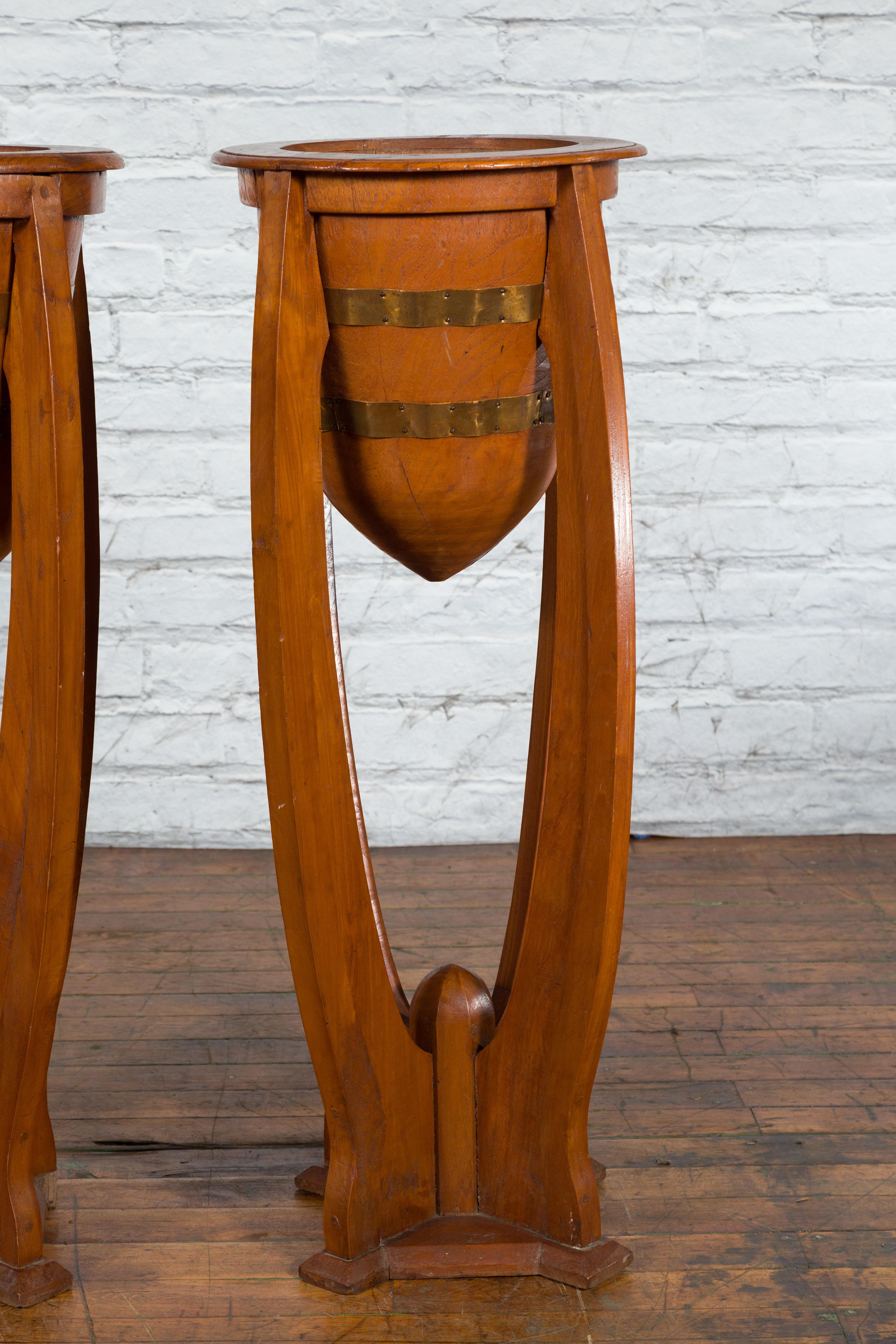 20th Century Large Pair of Javanese Art Deco Style Teak Wood Plant Stands with Brass Braces For Sale