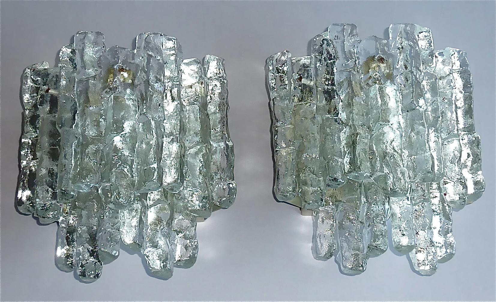 Large pair of textured crystal ice glass sconces or wall lights in Brutalist style by Kalmar, Germany, circa 1960s. Each lamp has an enameled metal base with a on/off string-switch which easily can be activated and five heavy handcrafted square
