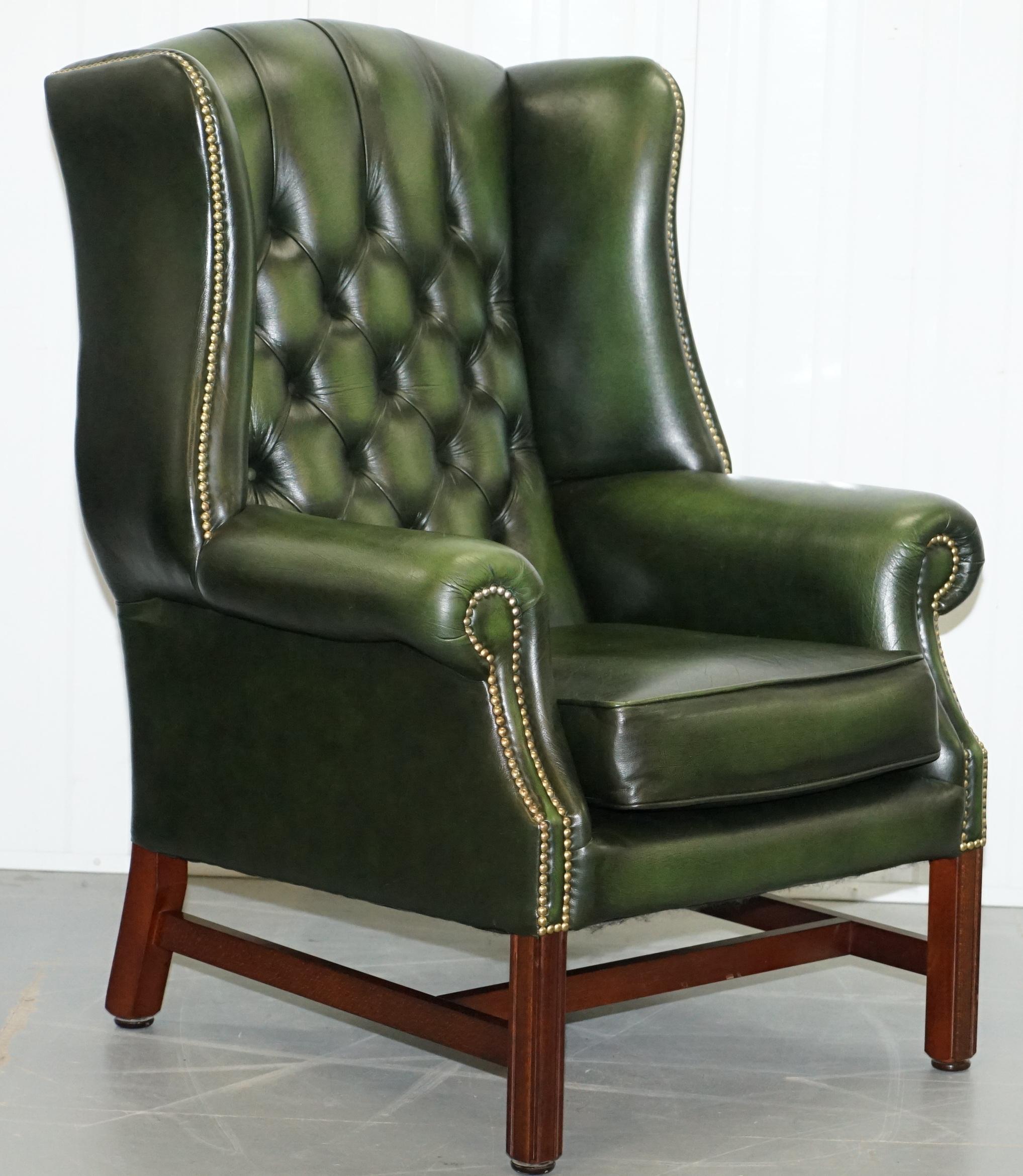 We are delighted to offer for sale this lovely pair of high-end luxury aged green leather Chesterfield Wingback armchairs and matching footstool

A very good looking and lightly used pair, these are larger than standard wingbacks and have a
