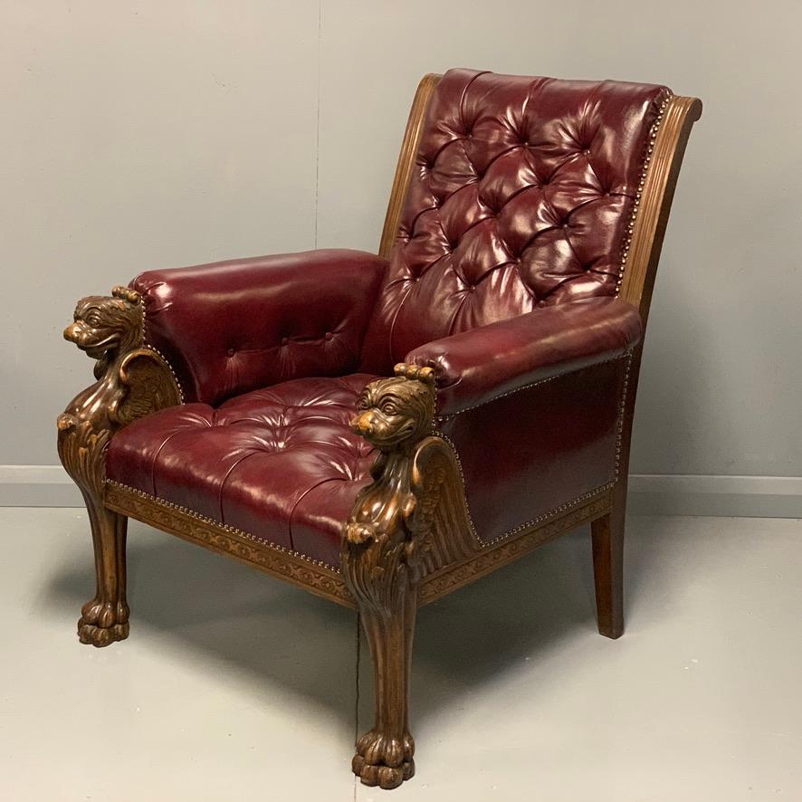 Belgian Large Pair of Mid-19th Century European Buttoned Leather Armchairs with Griffins For Sale
