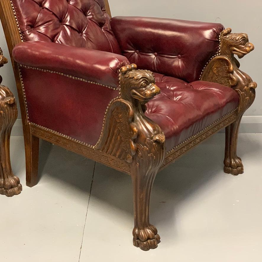 Large Pair of Mid-19th Century European Buttoned Leather Armchairs with Griffins In Good Condition For Sale In Uppingham, Rutland