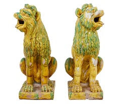 Large pair of mid 20th century Indonesian salt glazed decorative dogs