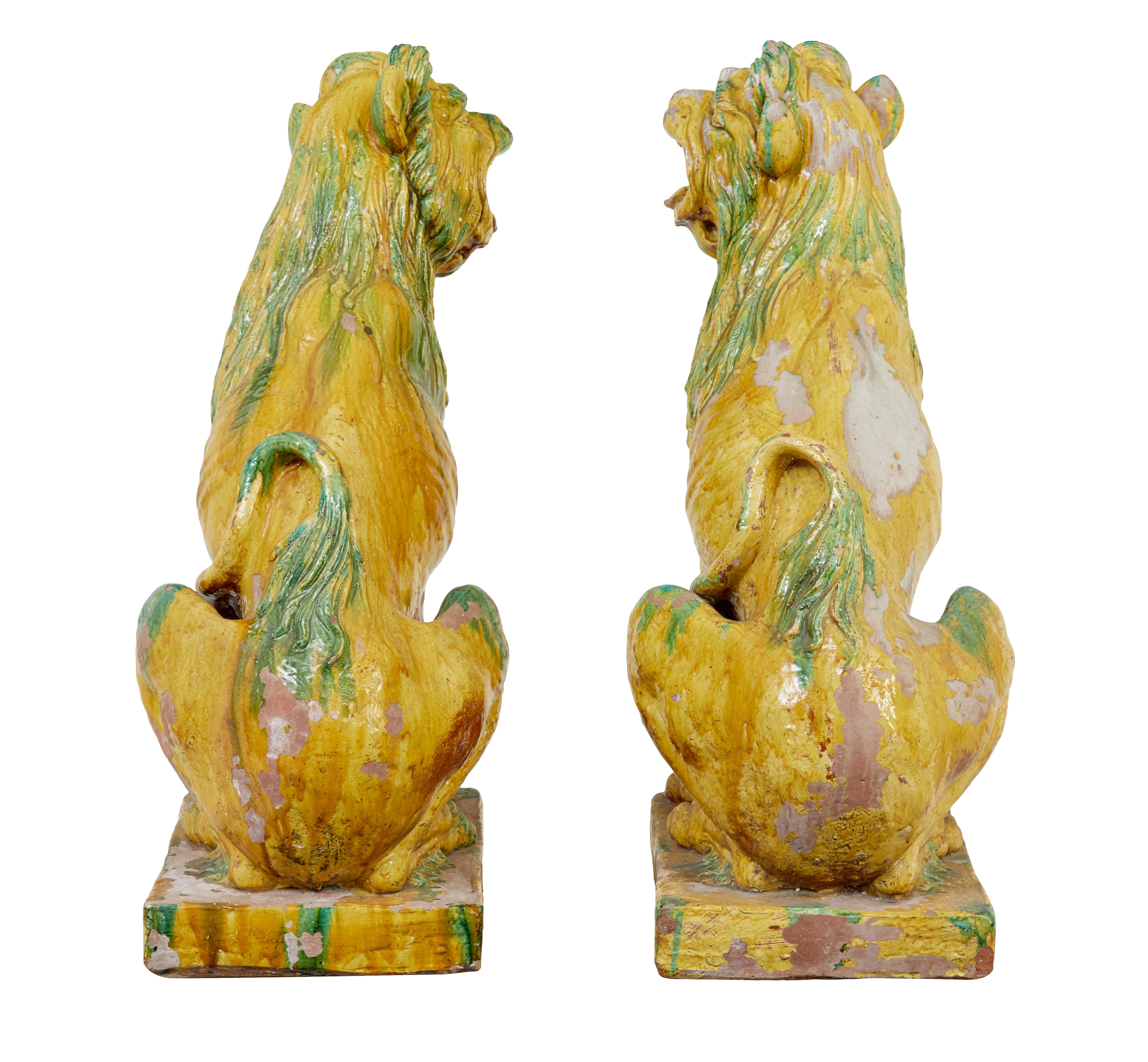 Glazed Large pair of mid 20th century Indonesian salt glazed decorative dogs For Sale