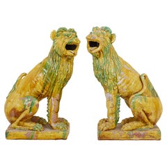 Large pair of mid 20th century Indonesian salt glazed decorative dogs