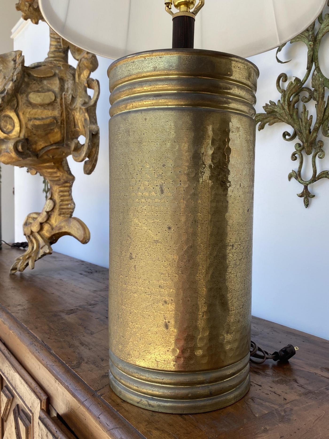 Each cylindrical hammered urn mounted as lamps.