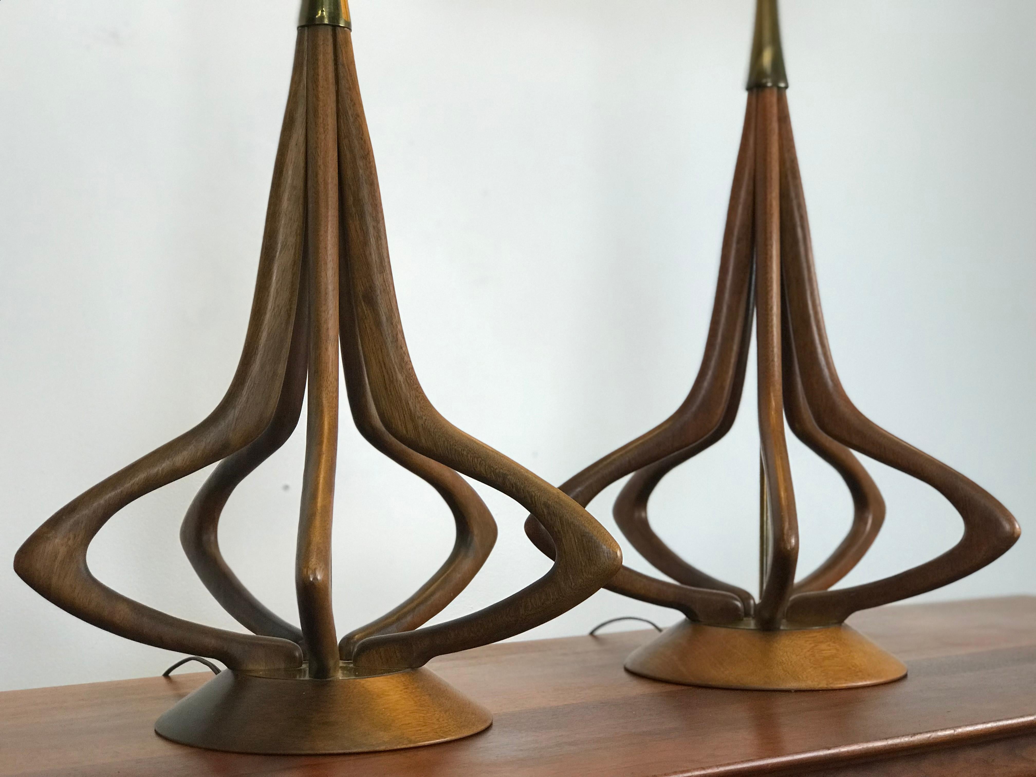Excellent size and lines to these great sculptural walnut Modeline 1950's lamps. Three way socket. 
Minor wear - nice vintage condition. 

I used a period correct shade in the pictures where there is only one shade. It is not included - but it is