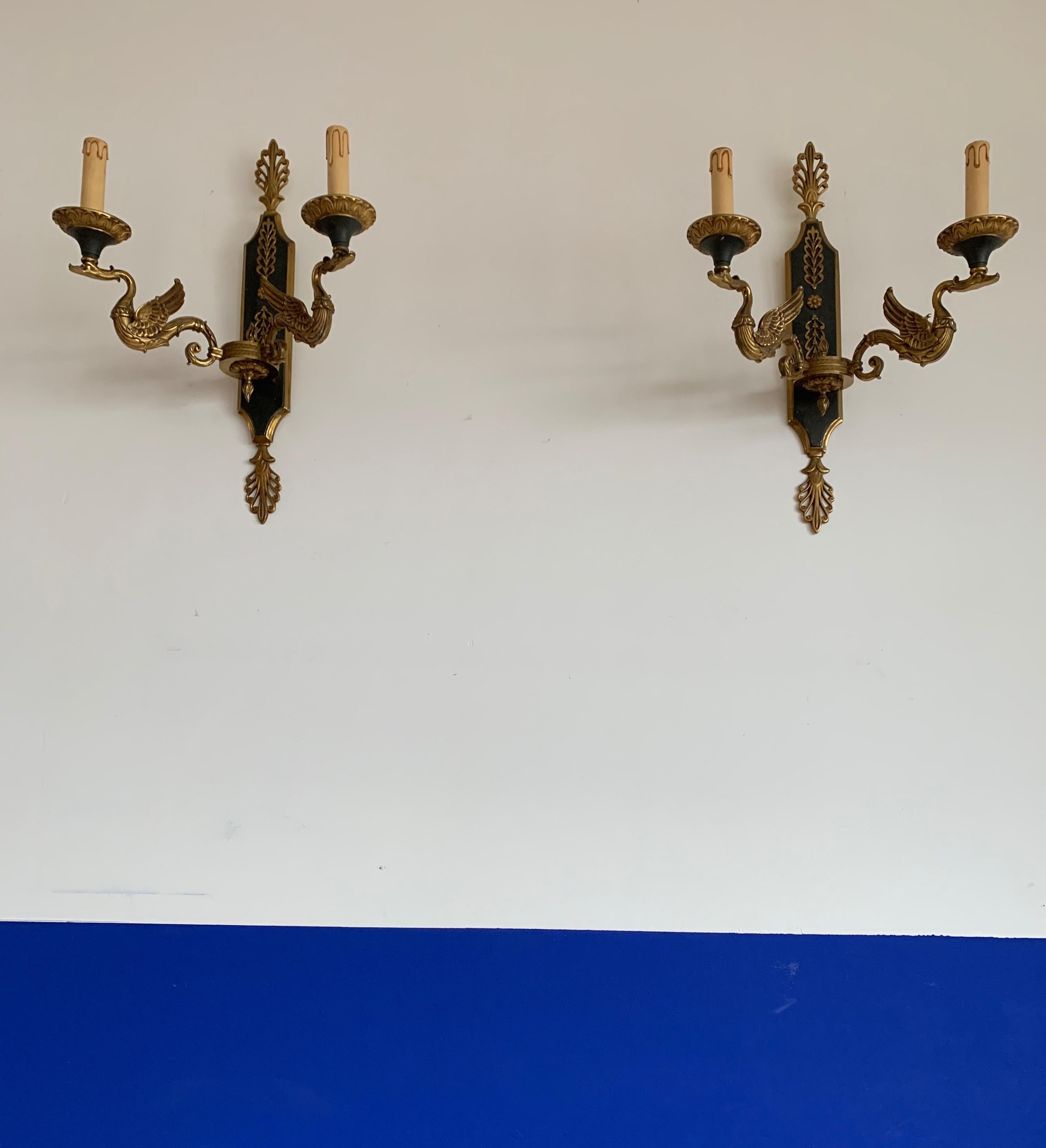 Stunning pair of near antique and all handcrafted bronze wall sconces.

These rare and majestic wall sconces were designed and all handcrafted in mid-20th century France. Created from costly, highly durable and great quality materials only, this