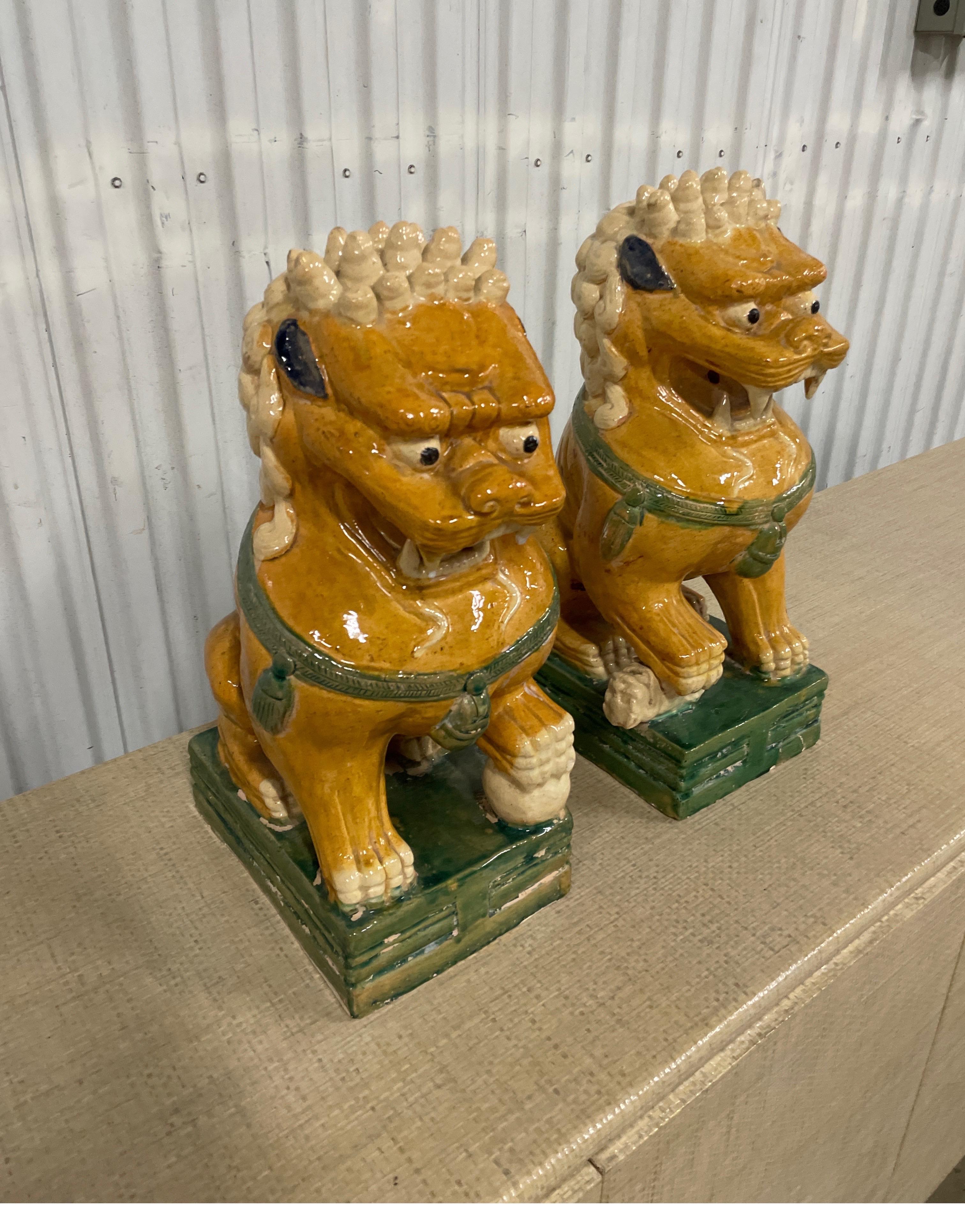 Chinese Large Pair of Multicolored Glazed Terra Cotta Foo Dogs For Sale