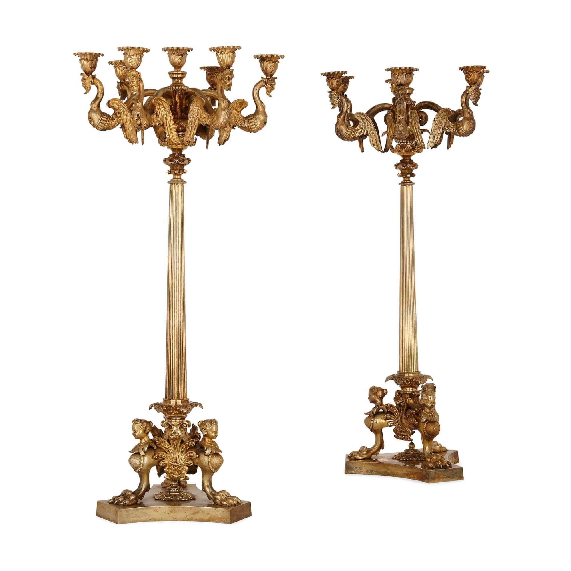 Pair of French gilt bronze table candelabra
French, 19th Century
Height 75cm, diameter 35cm

The fine gilt bronze candelabra in this pair are crafted in the eclectic style that prevailed during the reign of Napoleon III. The candelabra display hints