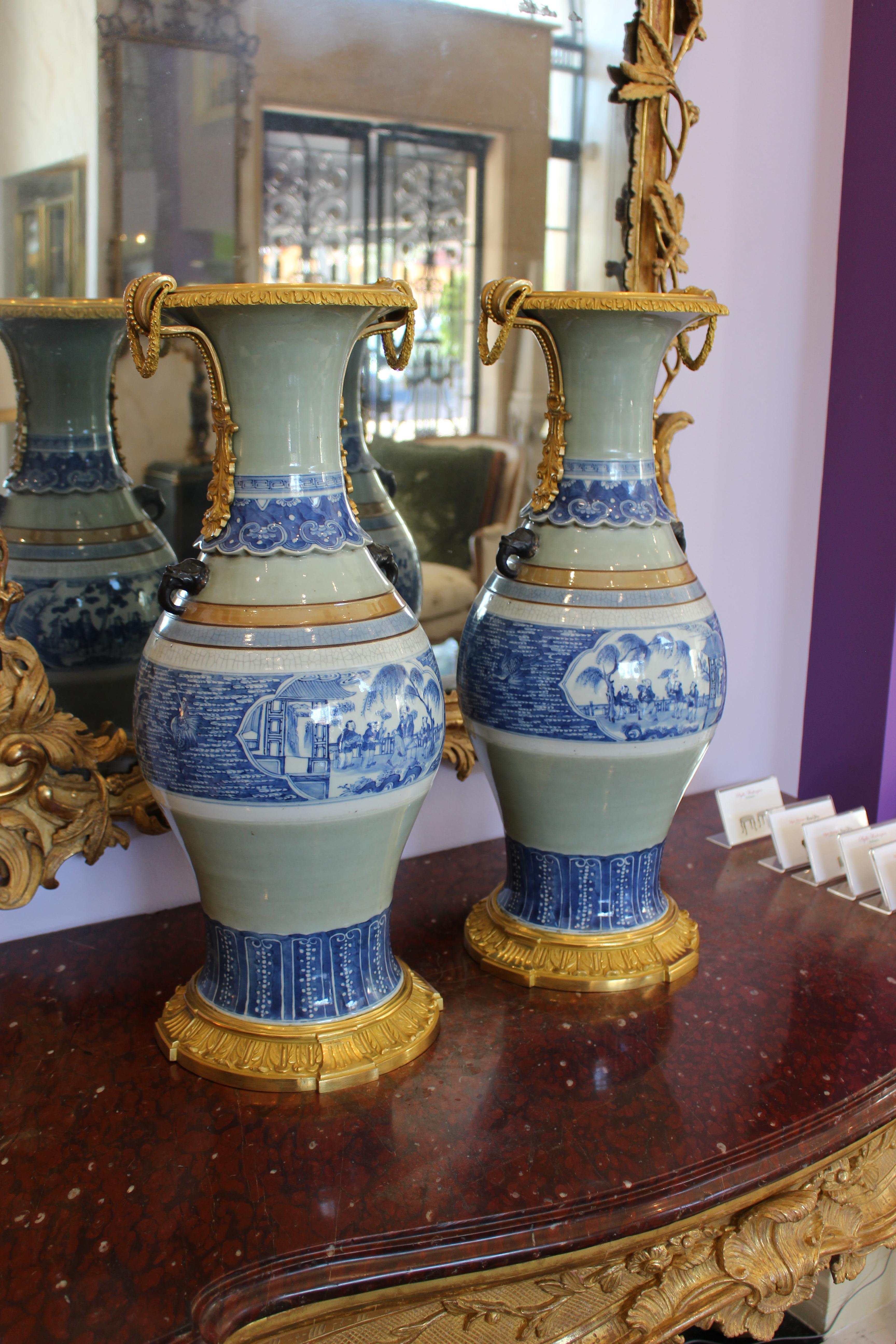 Large pair of ormolu-mounted Chinese celadon-glazed blue and white vases. 20th Century.