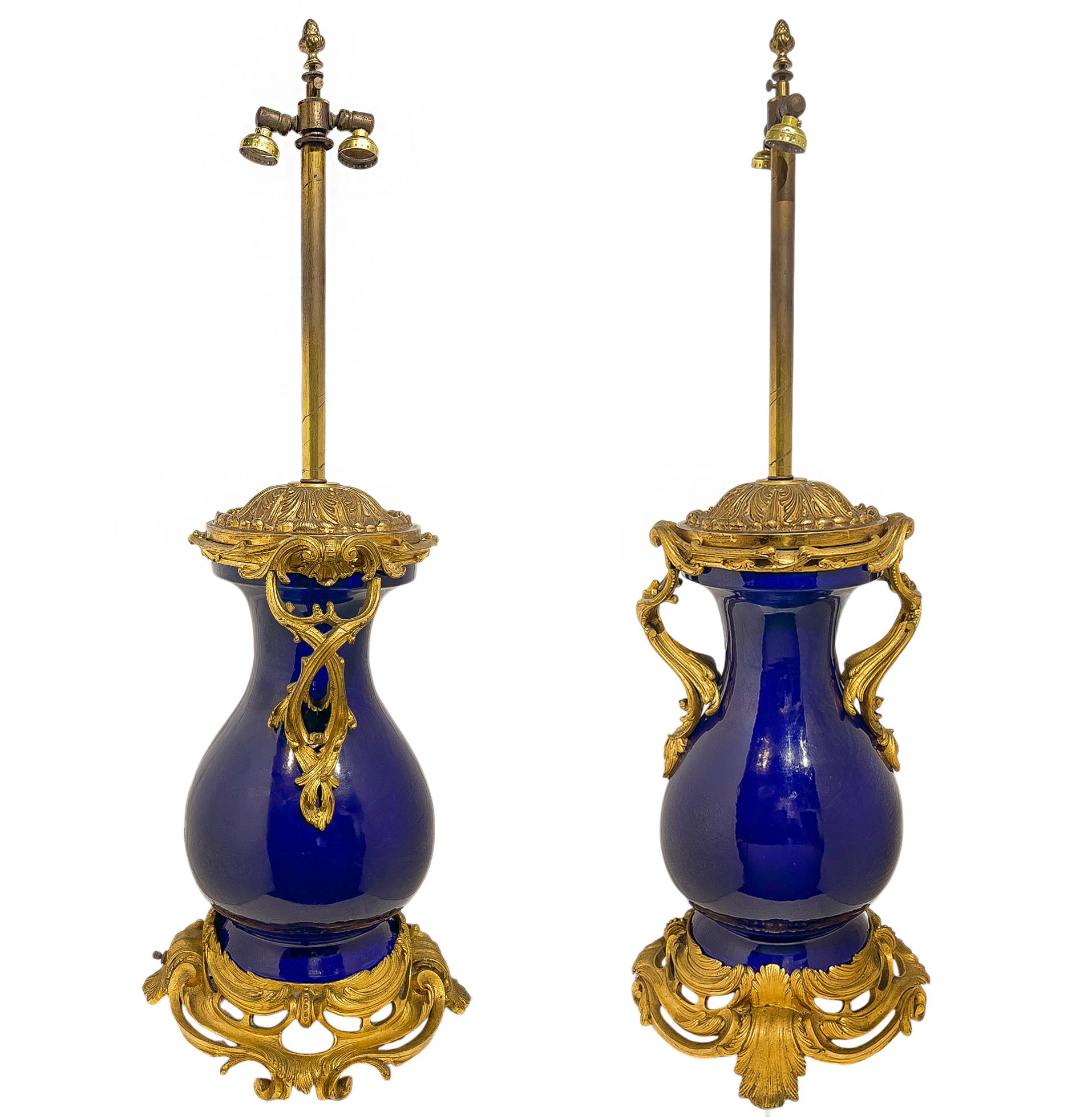 A large pair of antique ormolu mounted deep cobalt blue porcelain vases in the sèrves style converted to lamps. 

Origin: France

Date: late 19th Century 

Dimensions: 12