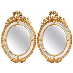 Grande paire de  Ovale Français 19ème siècle  Miroirs anciens en bois doré Louis XVI