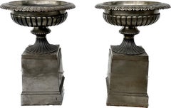 Large Pair Of Polished Steel English Urns On Stands