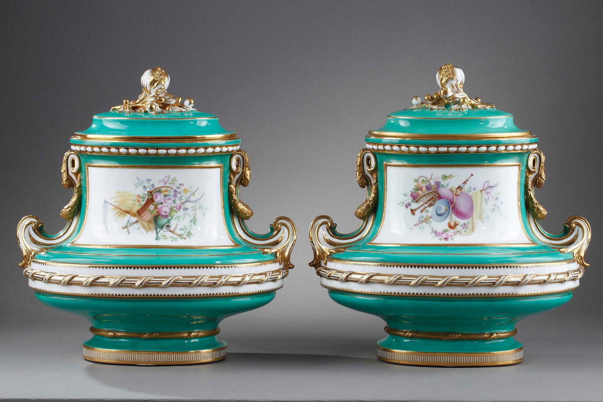 Large pair of vases with green background called «green garden» in porcelain resting on a base with gold flutings. The shape of the vase is architectured with handles decorated with stylized leafy garlands, ribbons and cords in white porcelain. The