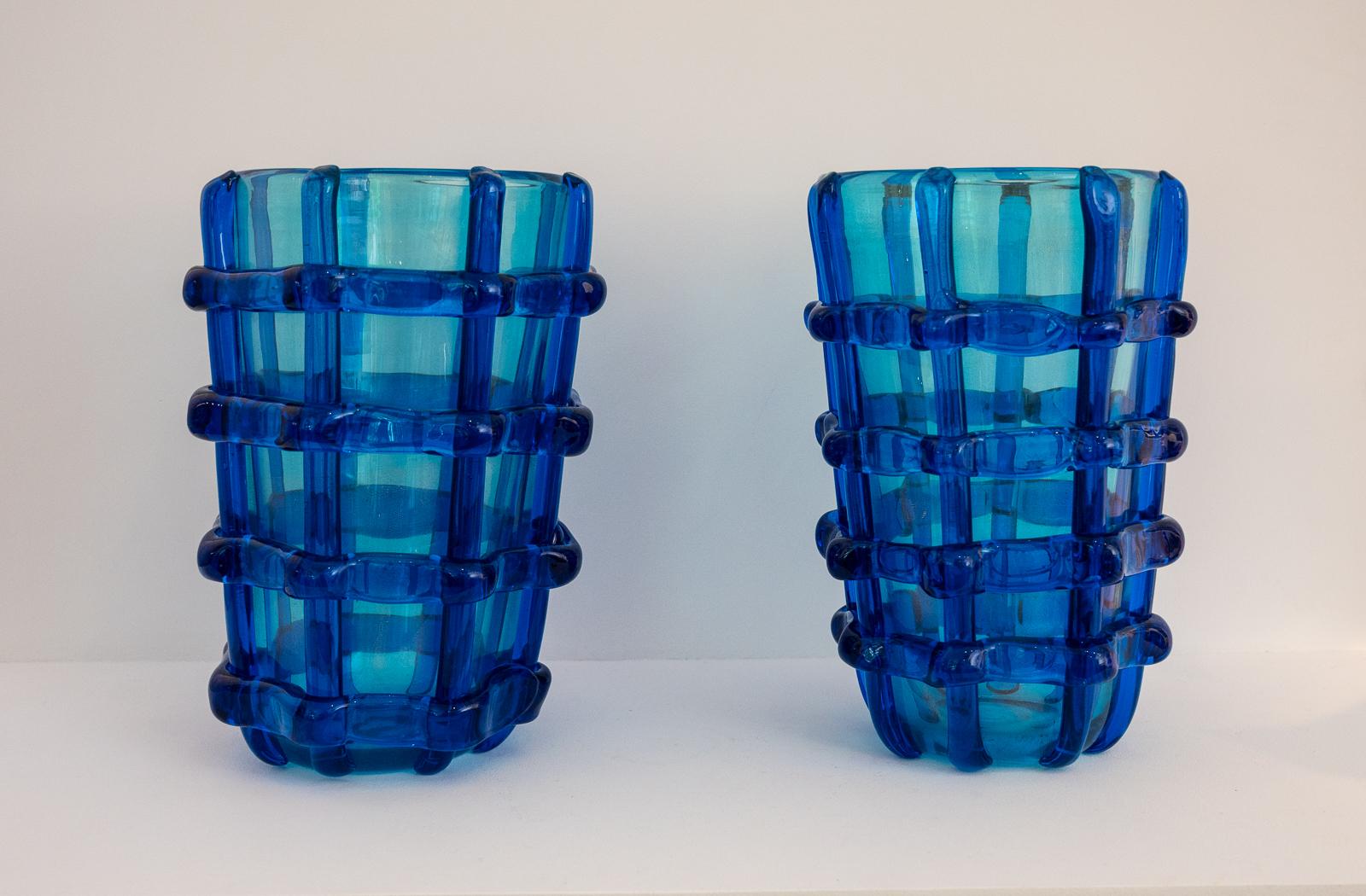 large pair of Murano vases signed Sergio Costantini
Heavy blue Murano glass, applied lattice work decoration with gold inclusions
Murano Italy, 1990s
priced for the pair.