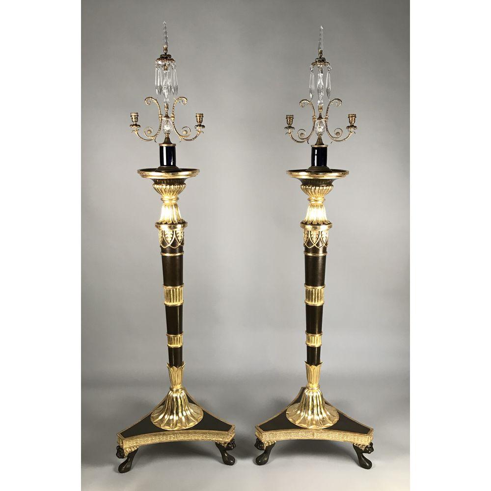 A large pair of English Regency period (1811-1820) cut-glass crystal and gilt metal lustres/ candelabra, circa 1815.

The blue glass cylindrical bases rising to twin delicately spreading foliate candle branches with eagle heads seizing serpents, and