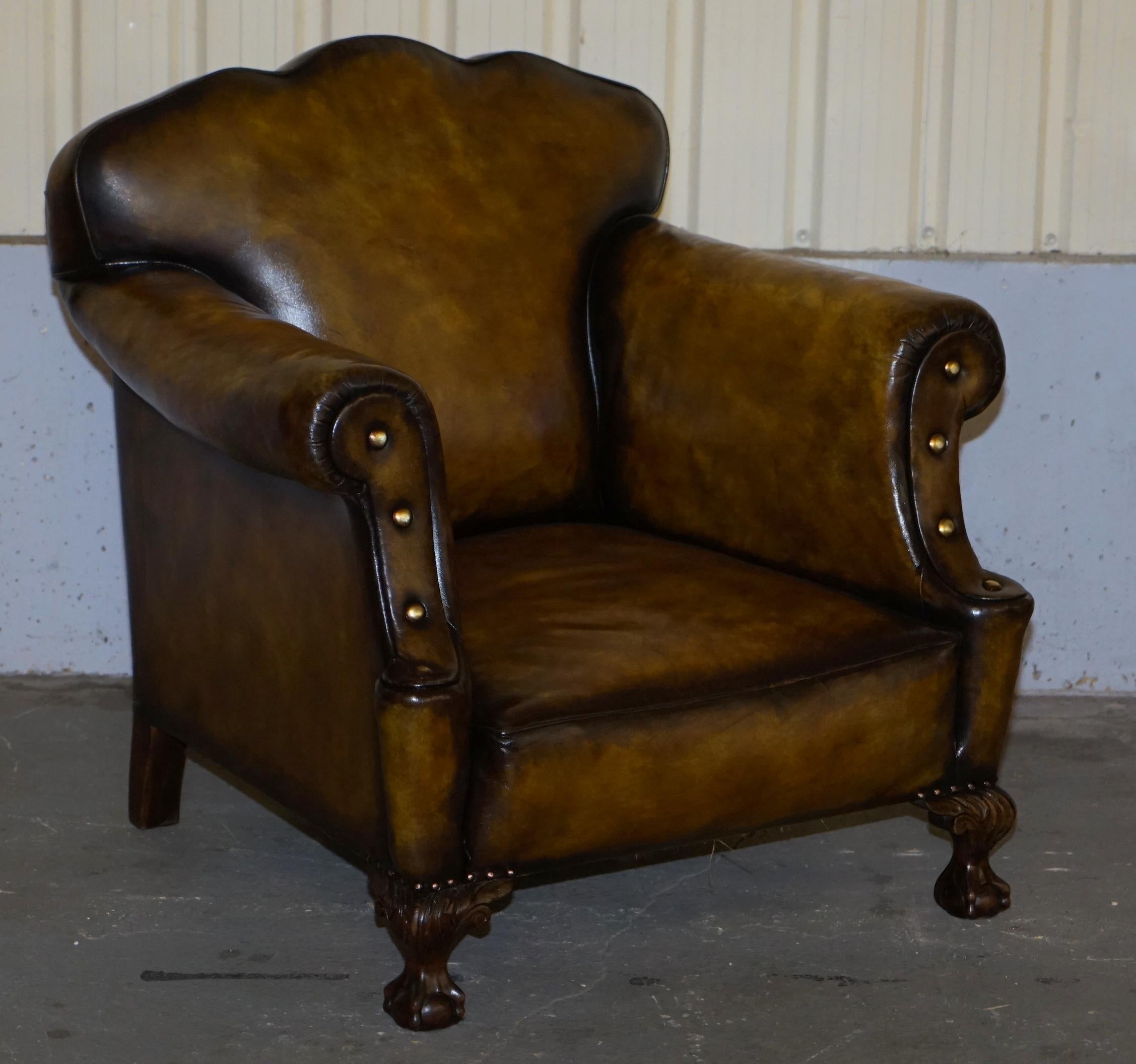 We are delighted to offer for sale this stunning pair of large fully restored hand dyed Cigar brown leather club armchairs with oversized studs and claw and ball feet

A very good looking well made and substantial armchairs. They are upholstered