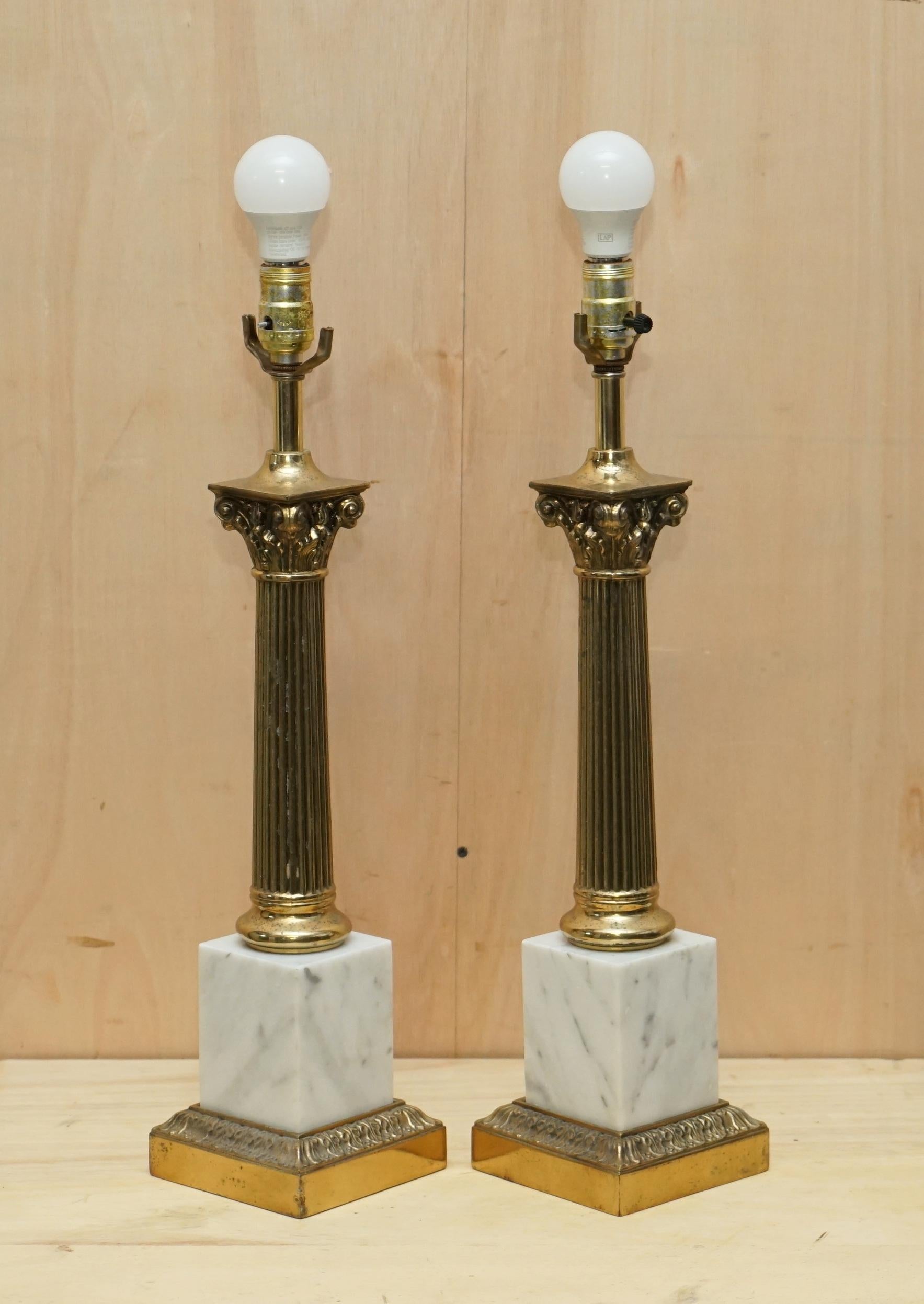 We are delighted to offer for sale this stunning pair of vintage Italian Carrara Marble & Brass Roman Corinthian Pillared table lamps.

These lamps came from a very fine antiques dealer in Belgium, he has a client that purchases antique Italian