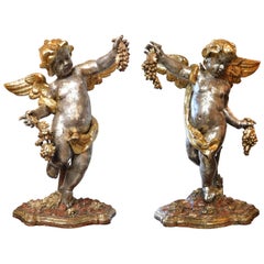 Large Pair of Roman Rococo Carved Giltwood Putti Harvesting Grapes