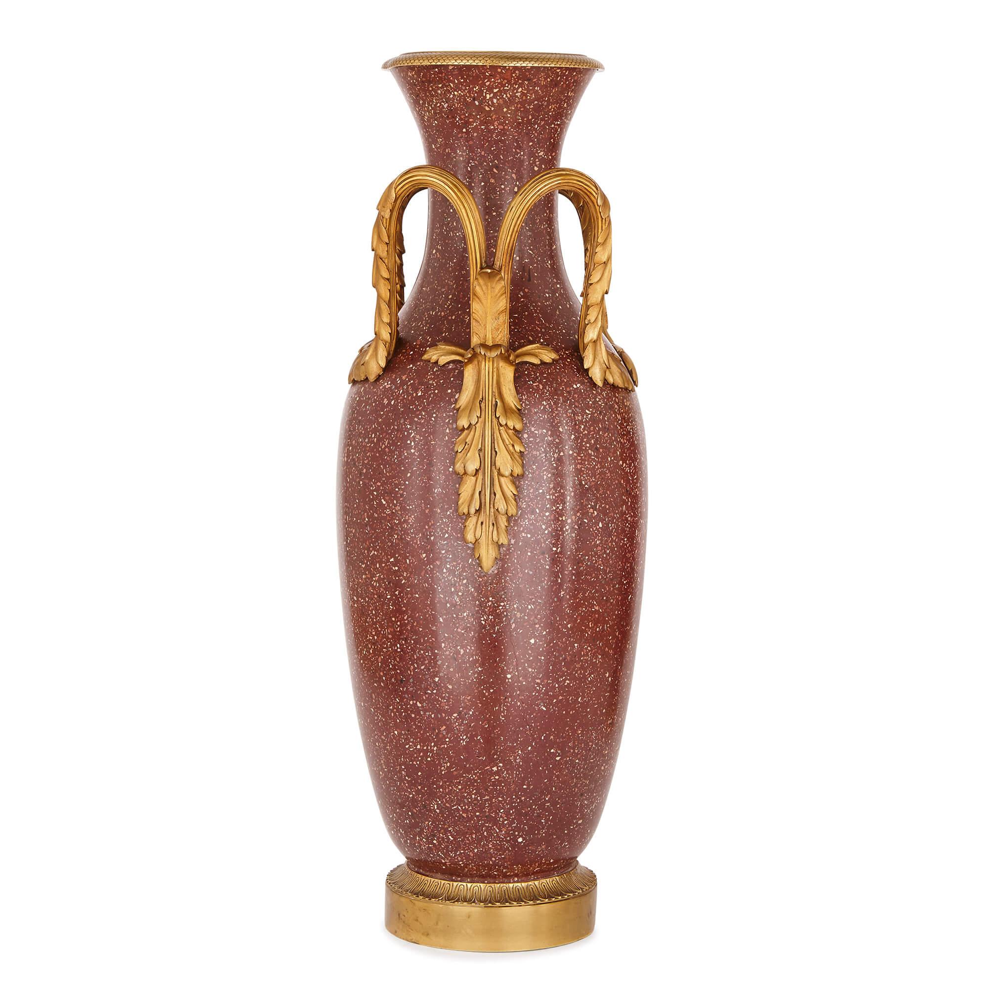 Rich, purple Scagliola and sumptuous gilt bronze combine to make these simple, chic and stylish vases, which feel as up-to-date today as they did in the 19th century when they were first made.

The vases are of tall, slender form, with a thin