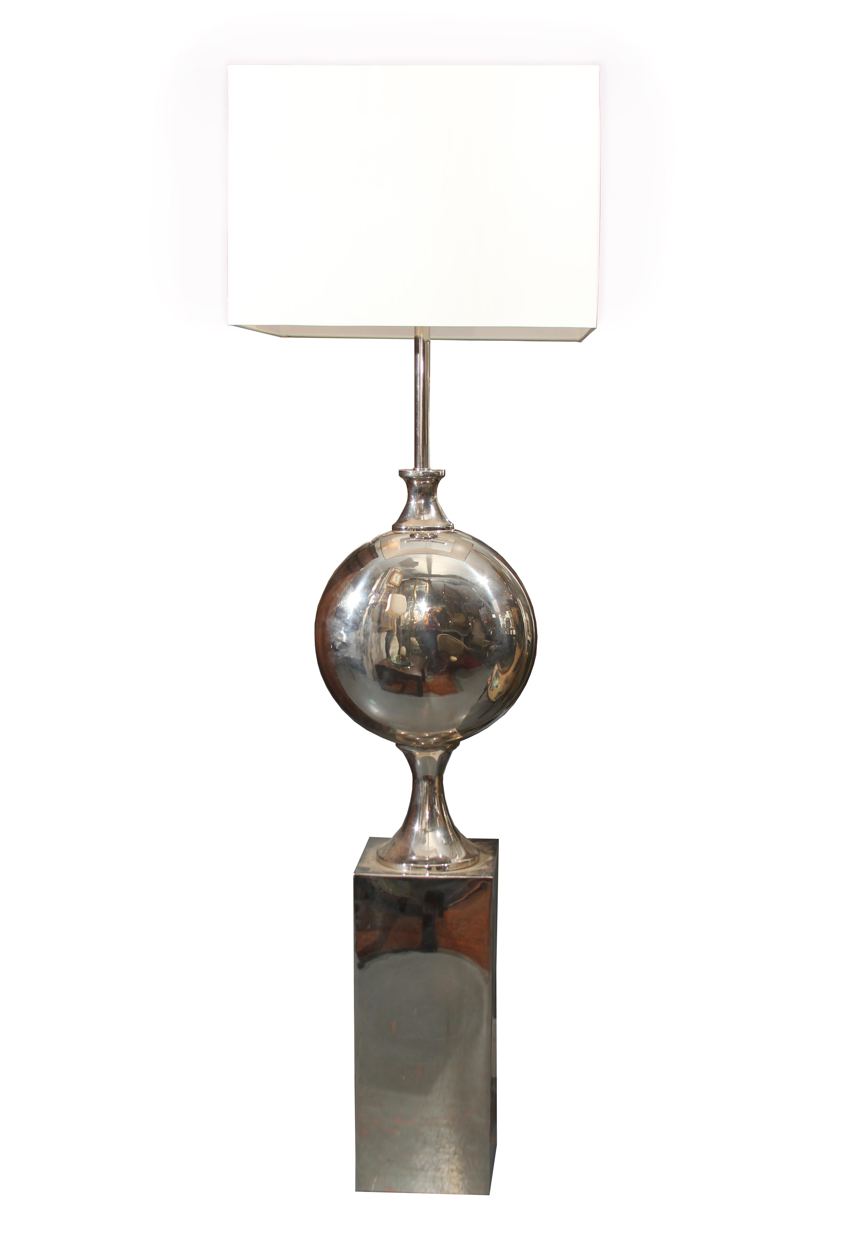 Large dramatic chrome floor lamps with large square linen shades these function as sculpture as well as task lighting. Shades measure 20 x 20 x 14 tall.