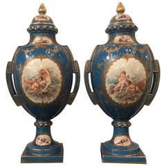 Large Pair of Sevres Style Painted and Raised Gilt Porcelain Urns