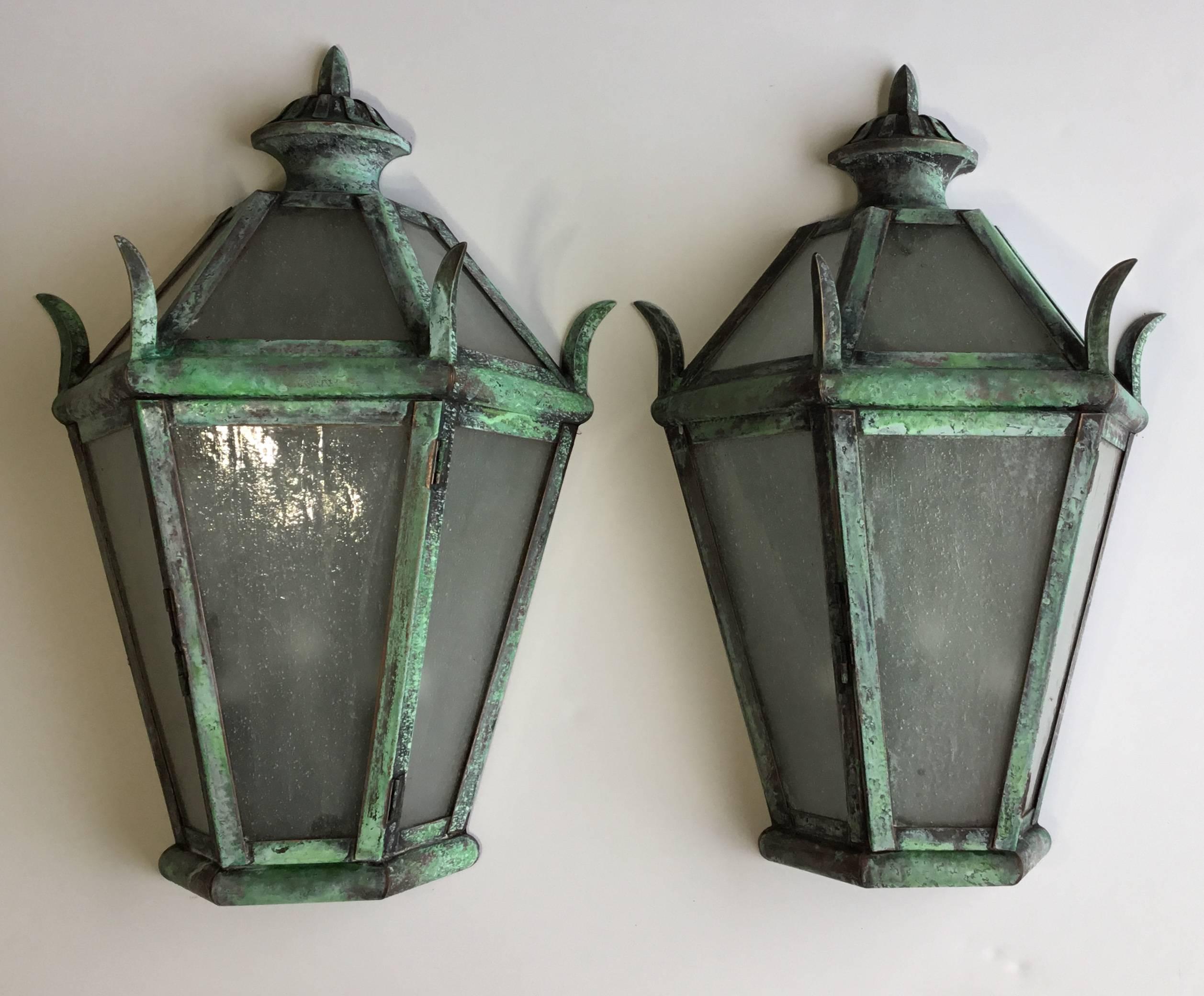 Impressive pair of wall hanging lanterns hand cratered from solid brass , with three 40/watt lights each , electrified and ready to use. Suitable for wet locations, UL approved up to US code.
Light milk glass color.