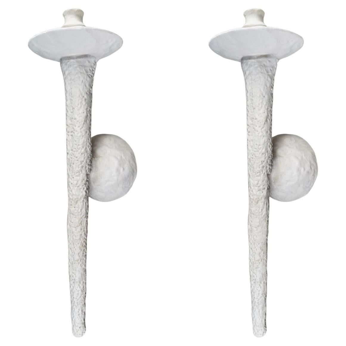 
Consisting of a round wall support on which rests a spindle-shaped torchiere.
At the top, the spindle flares out and is topped by a cup on which rests an electrified candleholder.

Custom-made by hand. 
1 bulb
Depending on the model, Rob Lemariey