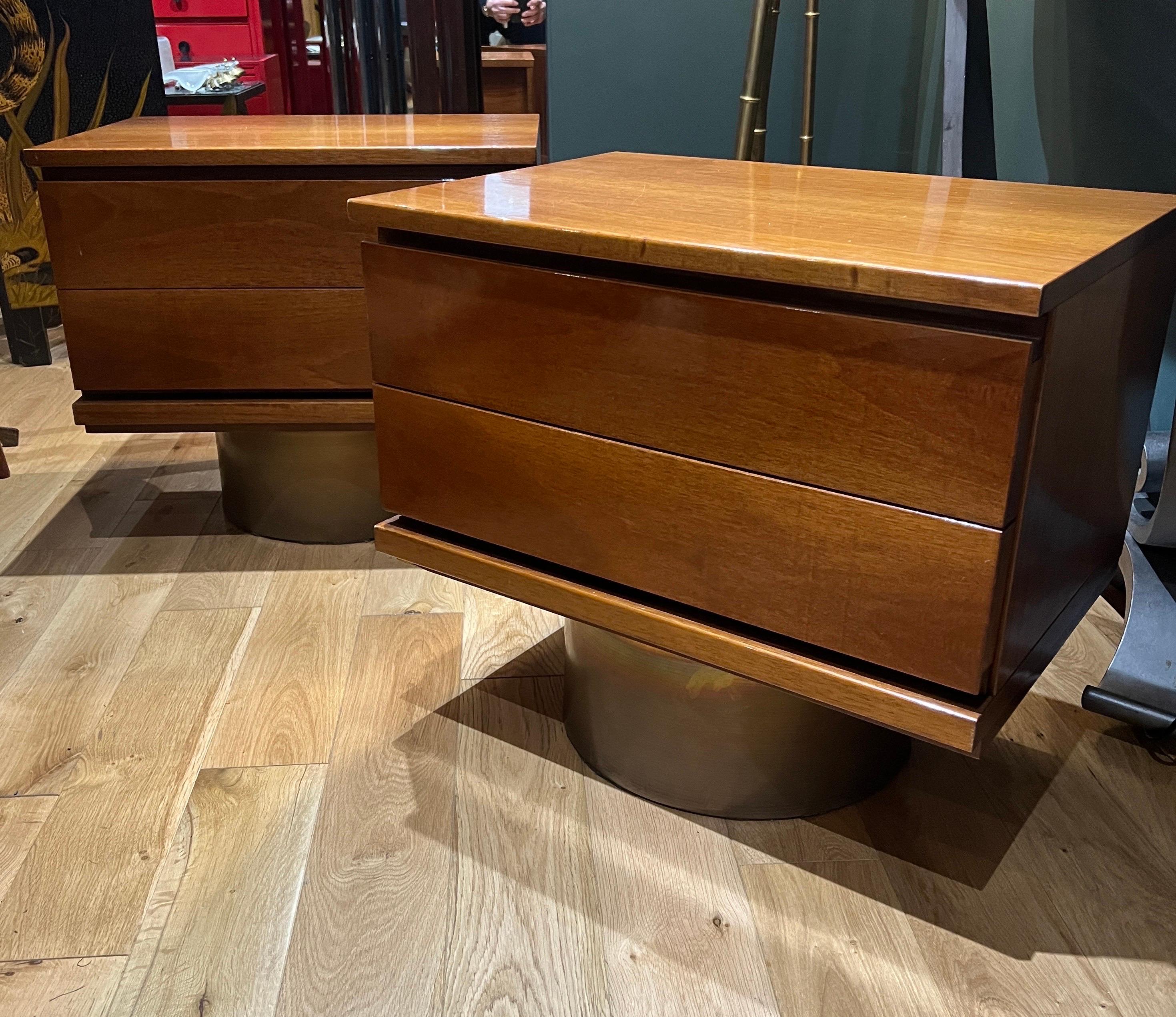 A fine pair of two drawers bedside cabinets made from polished walnut standing on drum shaped brass base . 

designed in the 1960s by Mario Morenco . Italy 