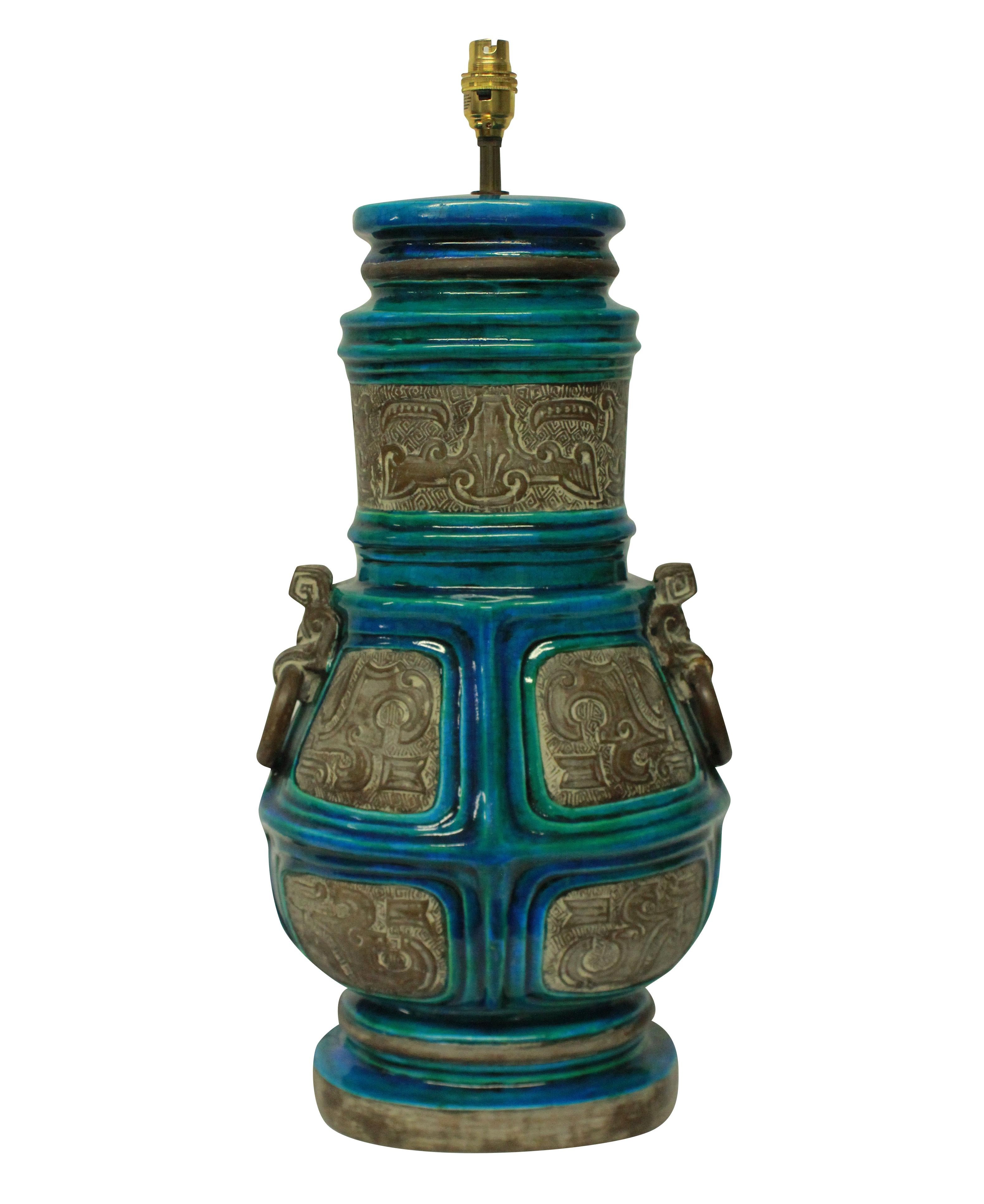 A pair of large Italian table lamps by Ugo Zaccagnini, in part glazed and part bisque glazed ceramic in turquoise blue, each hand numbered.