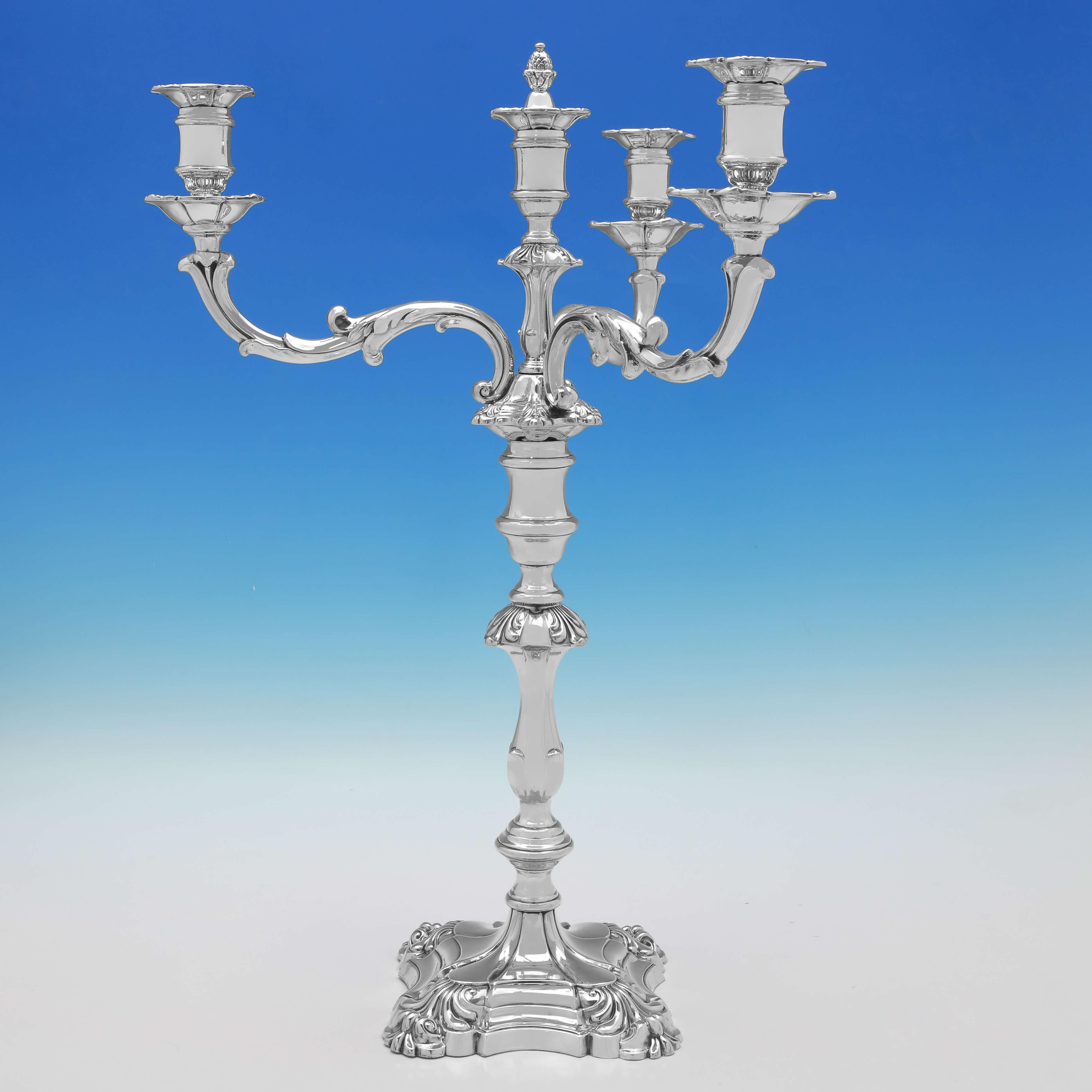 Hallmarked in Sheffield in 1844 & 1845 by Walter Knowle & Co., this stylish, and large pair of Antique Sterling Silver Candelabra, are in the '4 shell' style, and will hold 4 candles each. 

Each candelabrum measures 22