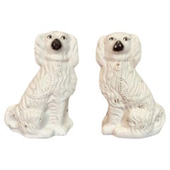 Large pair of Victorian seated Staffordshire spaniel dogs 
