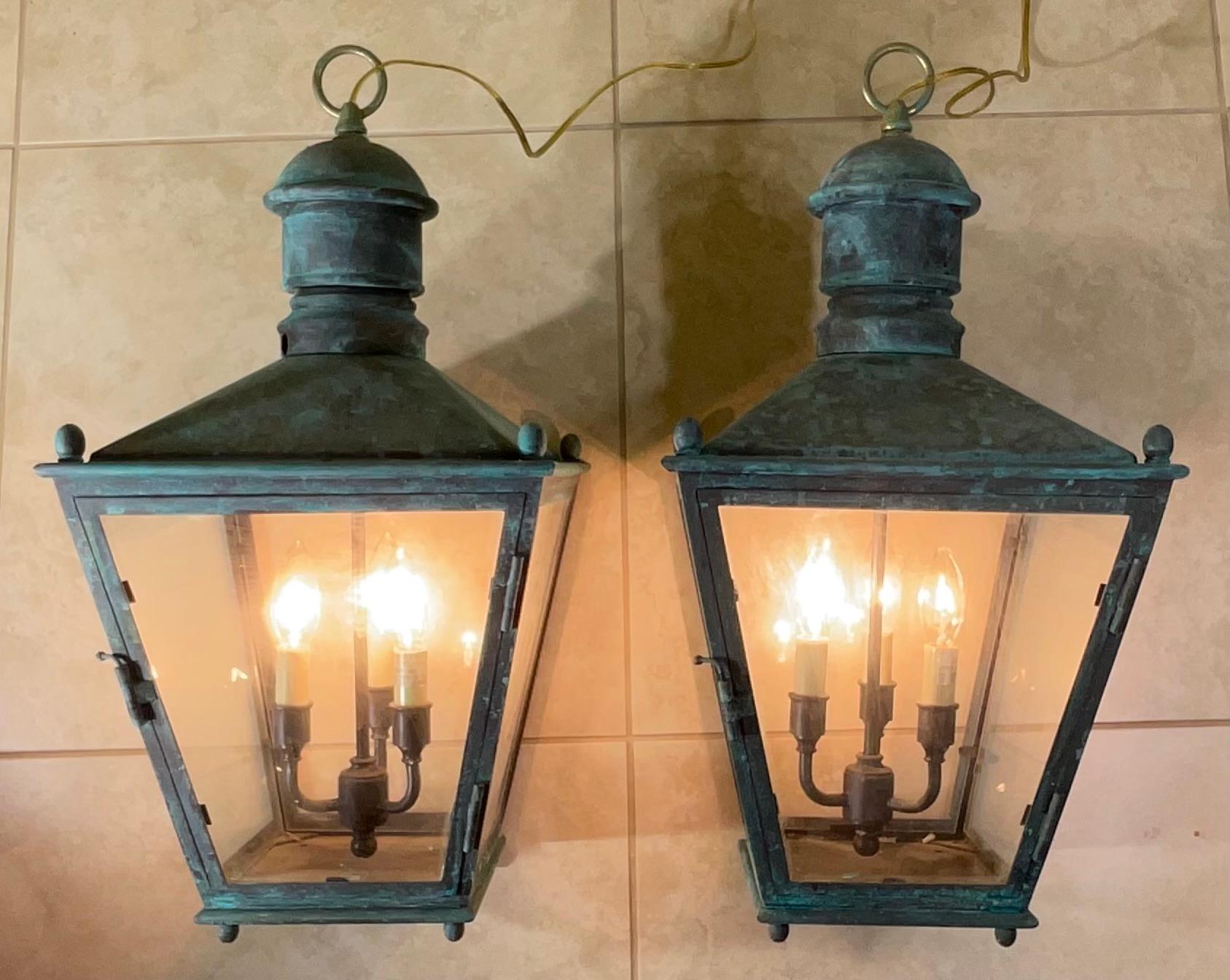 

Elevate Your Space with Timeless Charm.
These exquisite pair of vintage copper hanging lanterns will add a touch of classic elegance to any space. Crafted from high-quality copper clear glass ,and finished in a beautiful patina, these lanterns