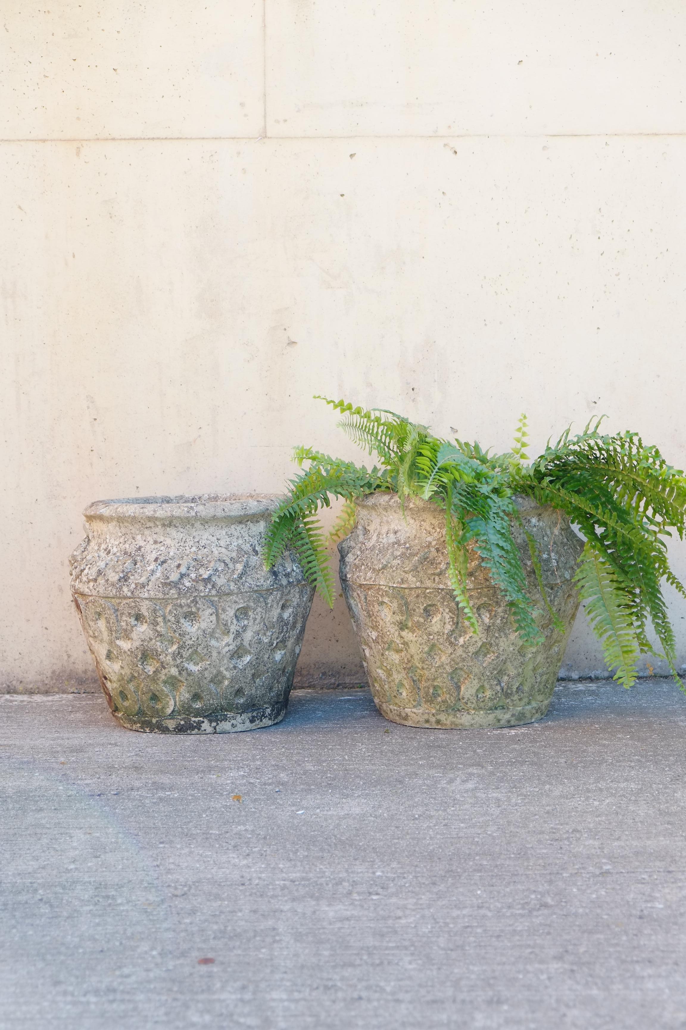 Large pair of Cotswold planters

Beautiful large pair of vintage planters attributed to the Cotswold potteries. This pair have a Classic Cotswold design of celtic knots and perfect old patina. Original, natural, weathered patina with lichen and