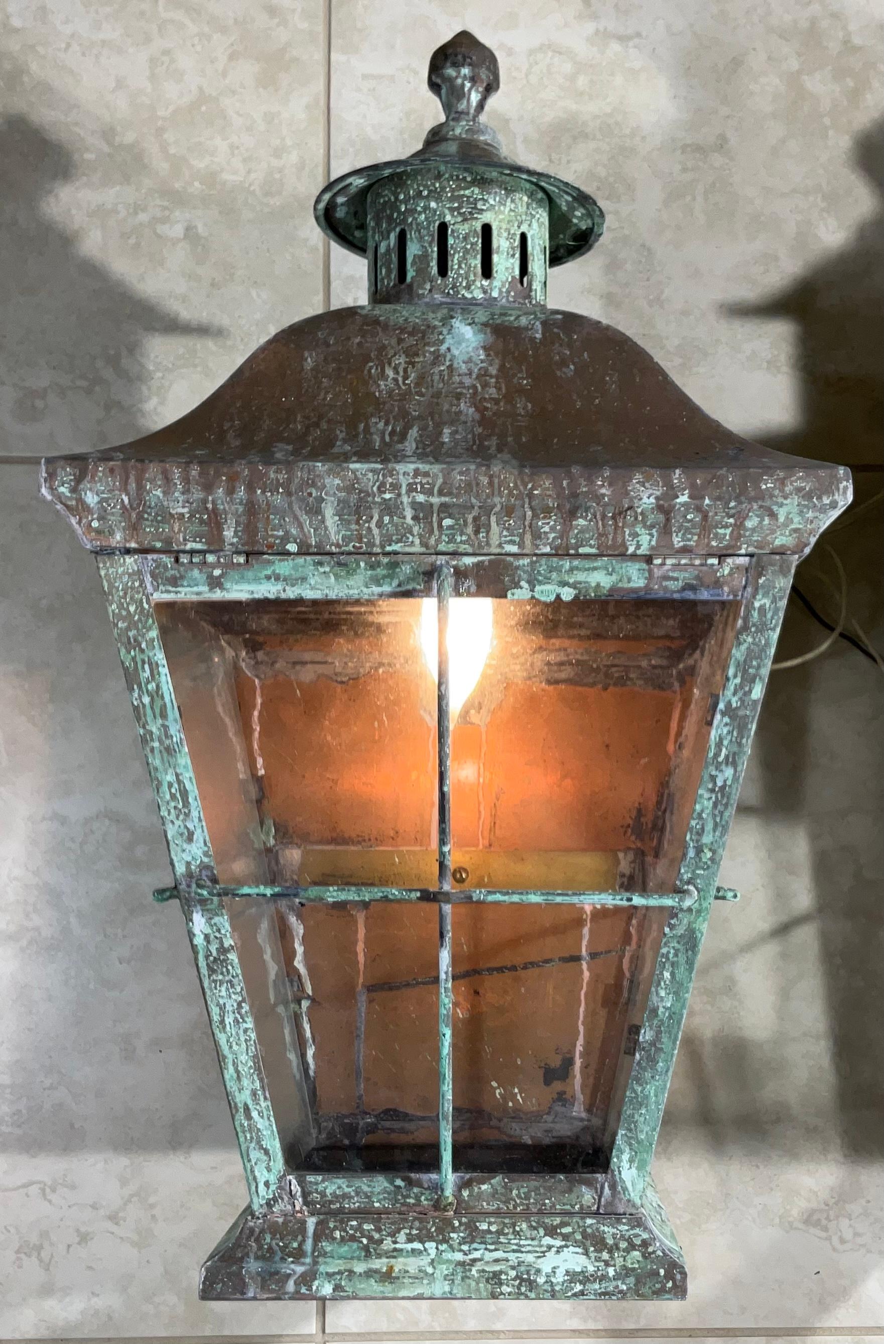 Impressive large pair of wall lantern made of solid copper and brass, quality workmanship, electrified with one 60/watt lights each, beautiful patina.
Back plate size :11”.5 x4”
Suitable for wet location. 
Decorative pair of lantern for indoor or