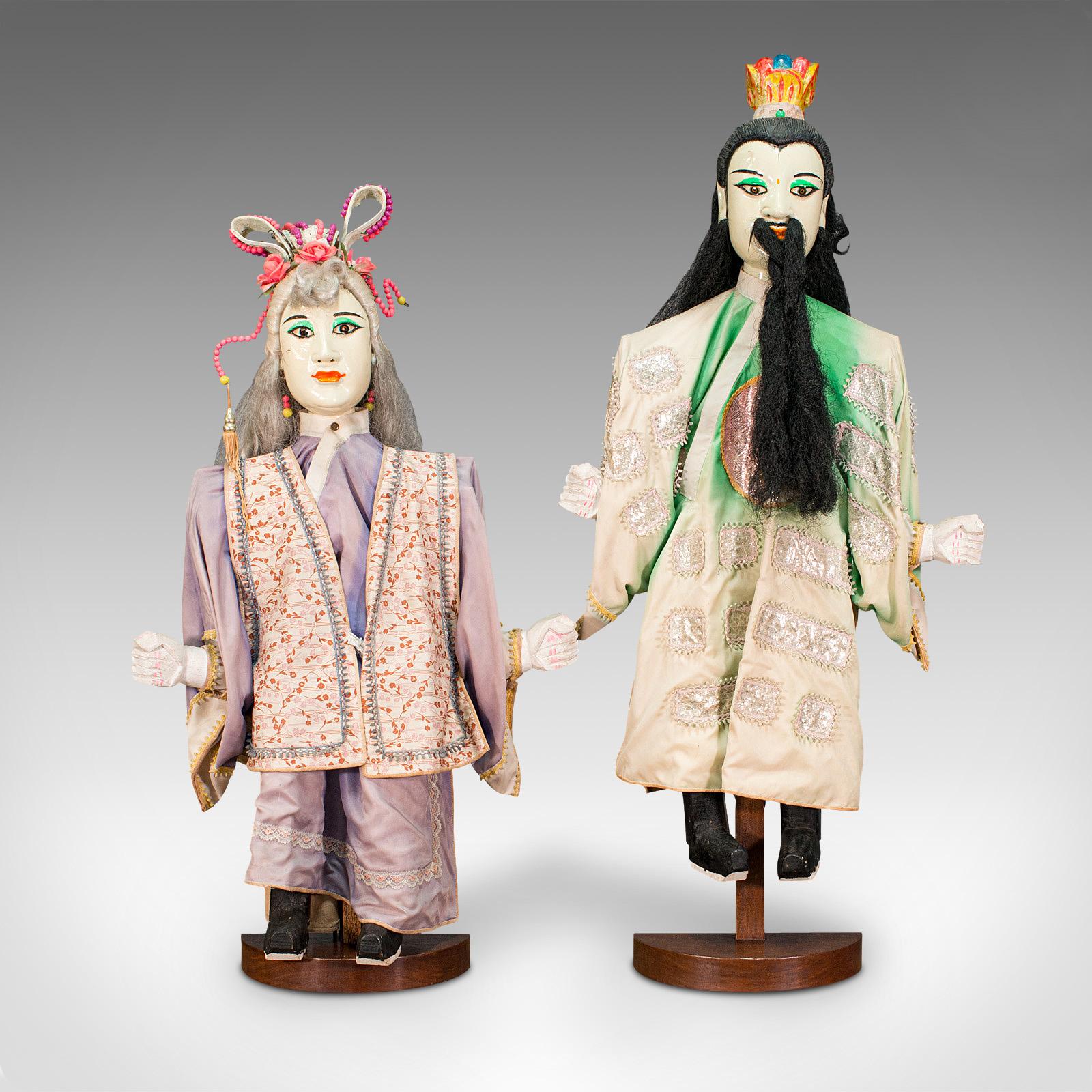 This is a large pair of vintage opera puppets. An Oriental, painted hardwood figure, dating to the mid 20th century, circa 1950.

Highly distinctive rod puppets presented for display
Displaying a desirable aged patina throughout
Painted hardwood