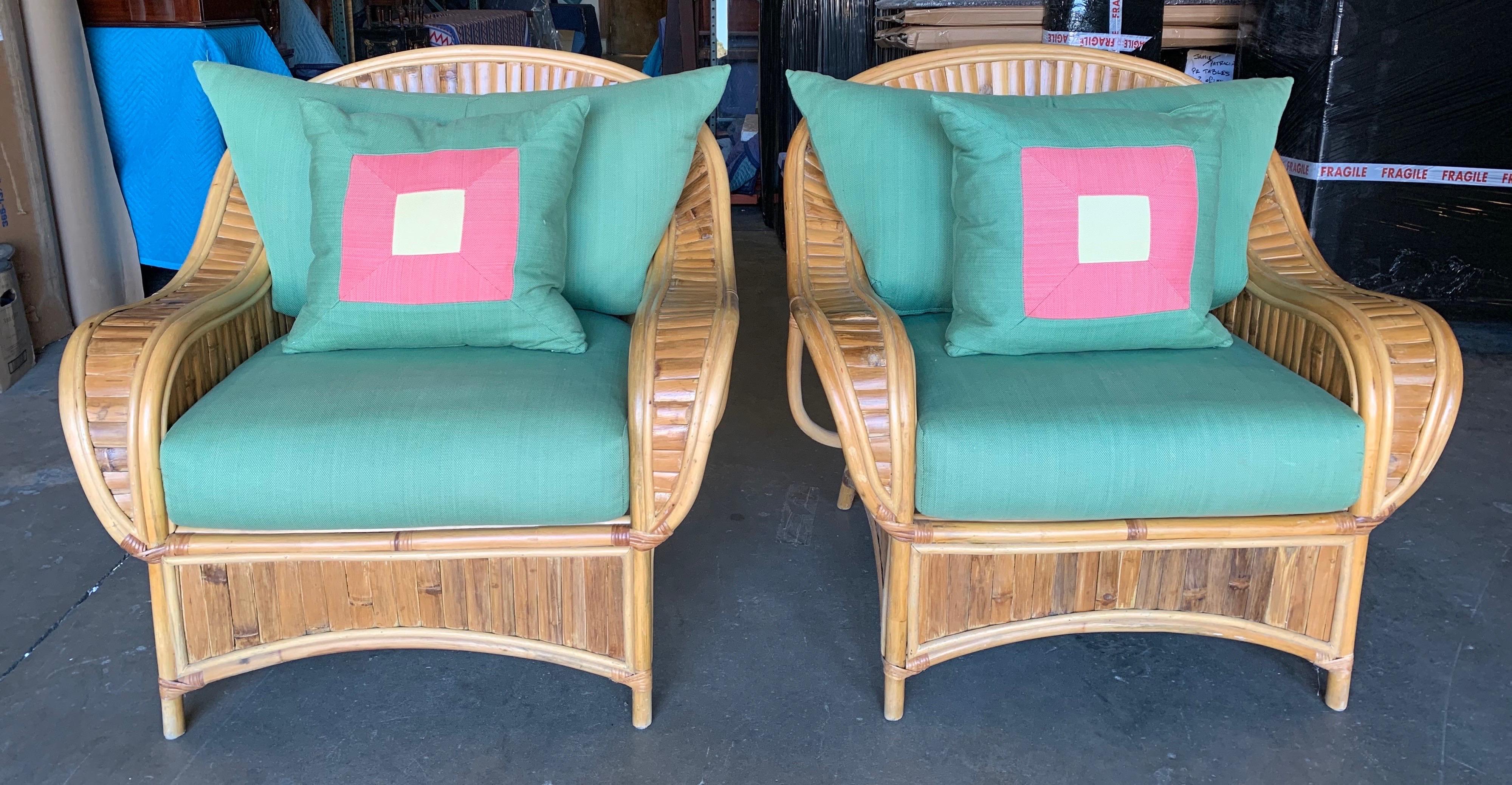 Great and comfortable large pair of vintage rattan club chairs with pillows.