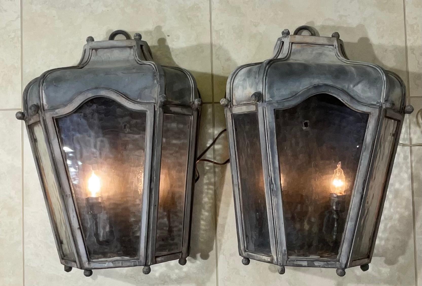 Impressive large pair of wall sconces / lantern , artistically hand forged from galvanized steel, coated with protective layer, decorative art glass , with two 60/watt light each , great for large entrance or indoor interior.