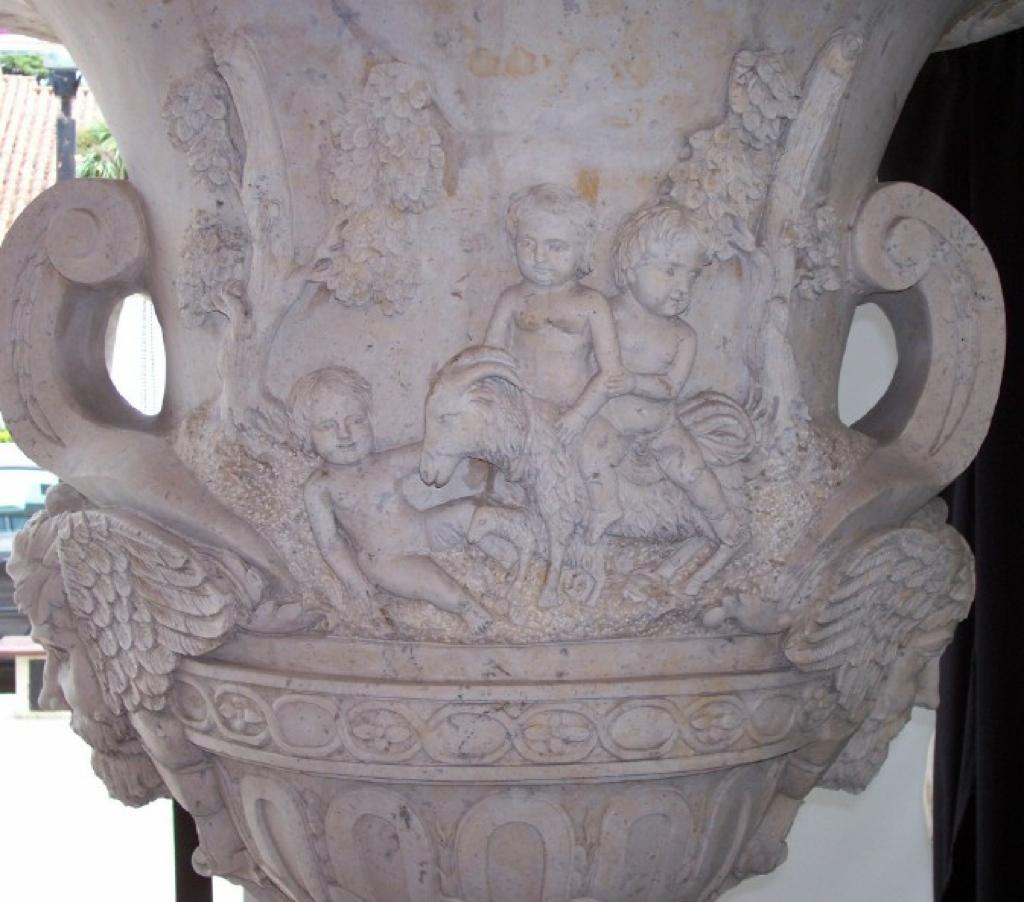 Hand-Carved Large Pair Urns on Pedestals For Sale