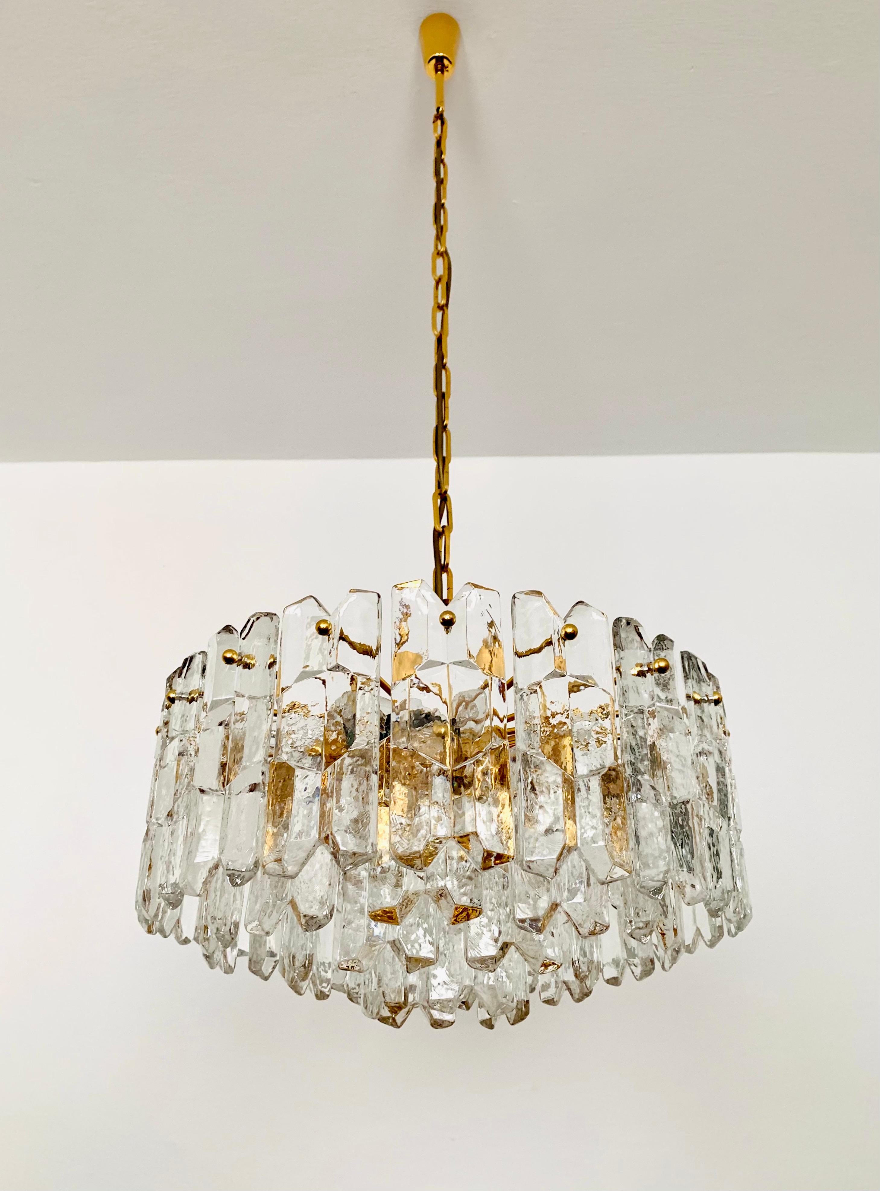 Wonderful and large ice glass chandelier from the 1960s.
The 42 beautifully shaped Murano glass elements create an impressive, sparkling play of light.
Exceptionally high-quality workmanship.
Very noble and luxurious appearance and a real