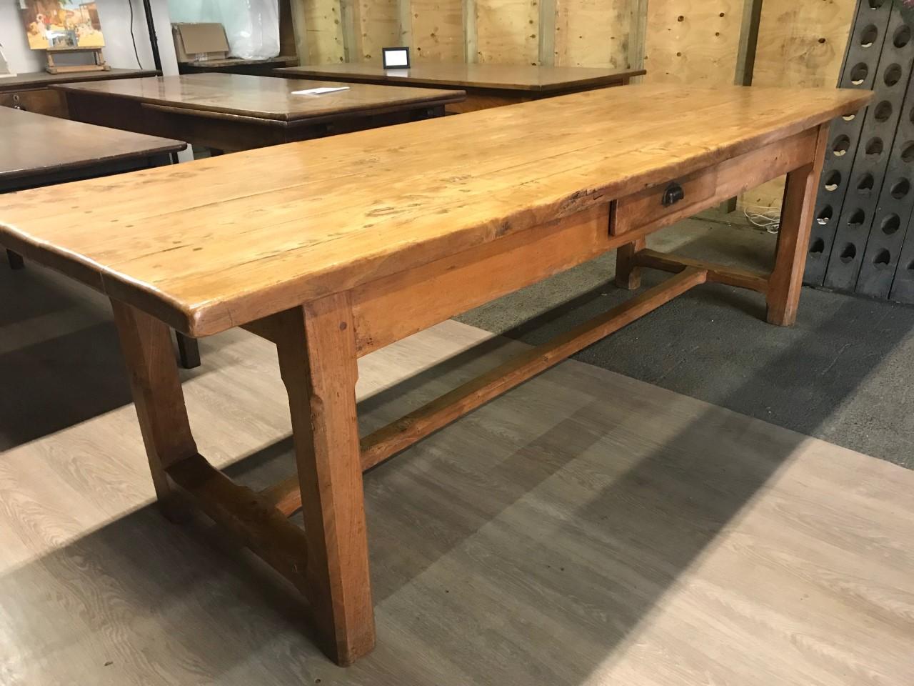 Large Pale elm French farmhouse table with drawer and centre stretcher. Gorgeous color and patination. The table stands on square legs supported by stretcher. Great overhang on each end and ample leg room. This table will seat 10 people