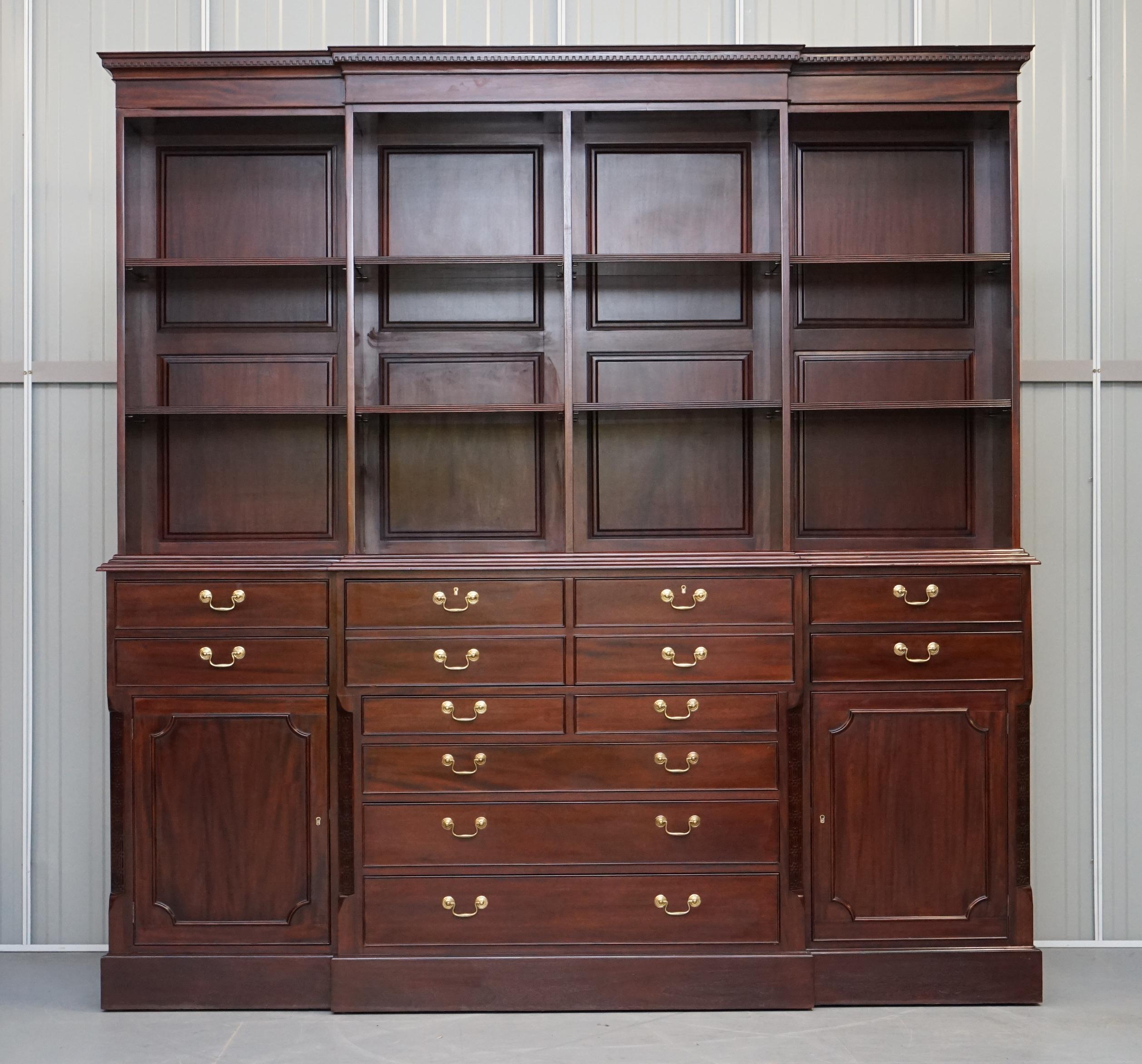 We are delighted to offer for sale this stunning solid panelled mahogany library bookcase with height adjustable shelves, multiple drawers and drop front bureau desk 

A well made and substantial piece made in the Thomas Chippendale style. This