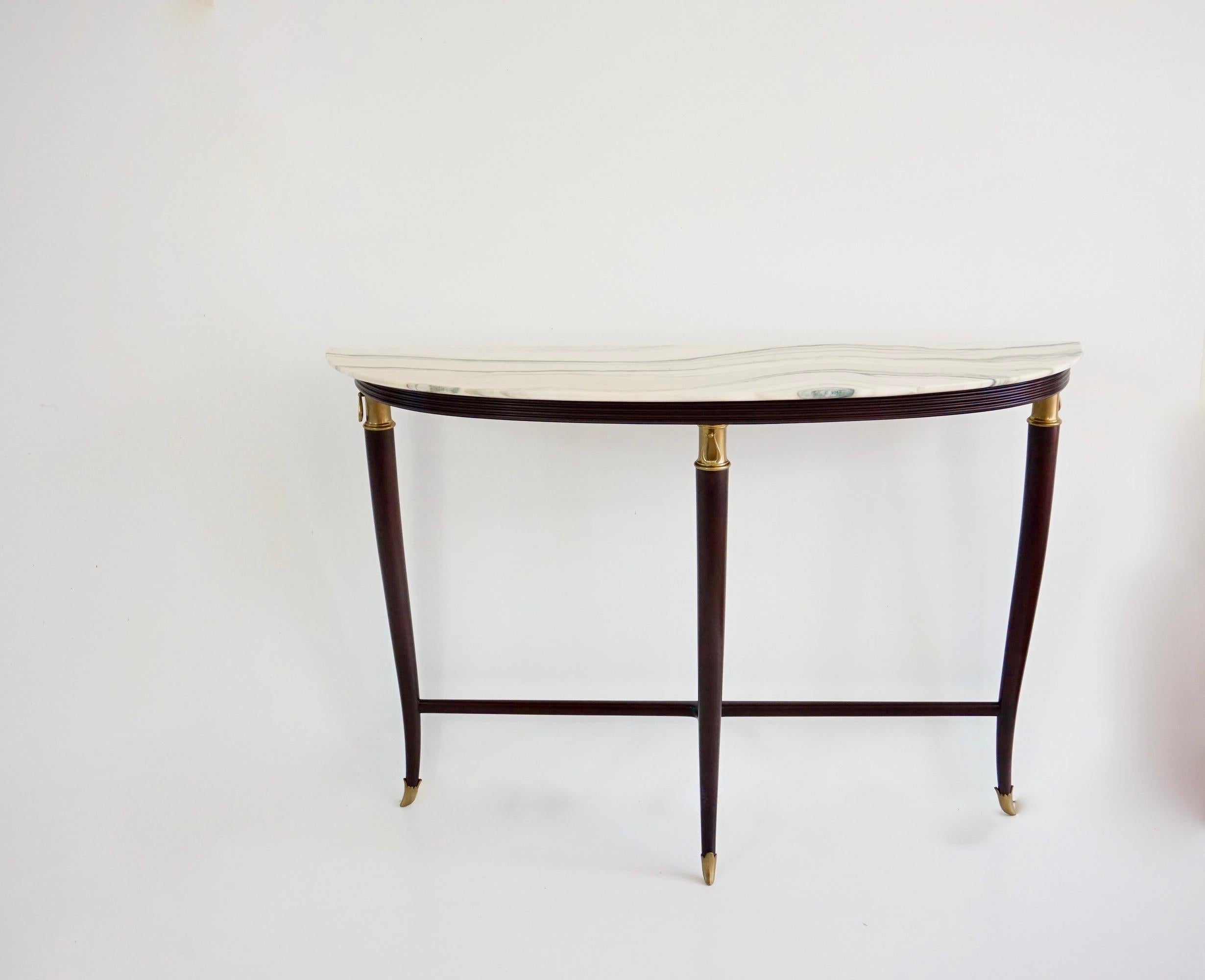important large and fine demi-lune shaped console designed by Paolo Buffa, circa 1940
ebonized walnut, bronze details and rare top  
