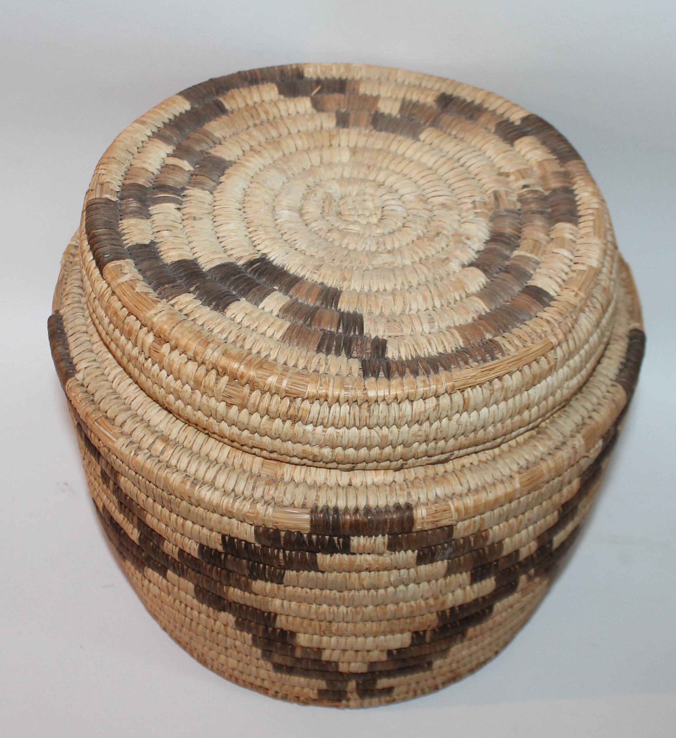 Large lidded Papago basket in good condition. The large basket is made from sea grass. Great pattern and great age with patina.