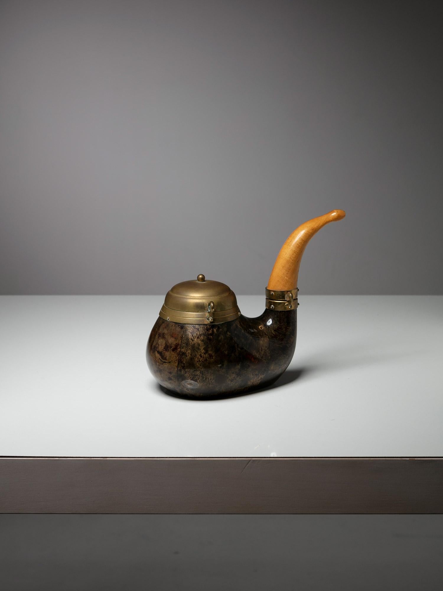 Pipe shaped box by Aldo Tura for Macabo.
Parchment covered piece with brass and ash wood details