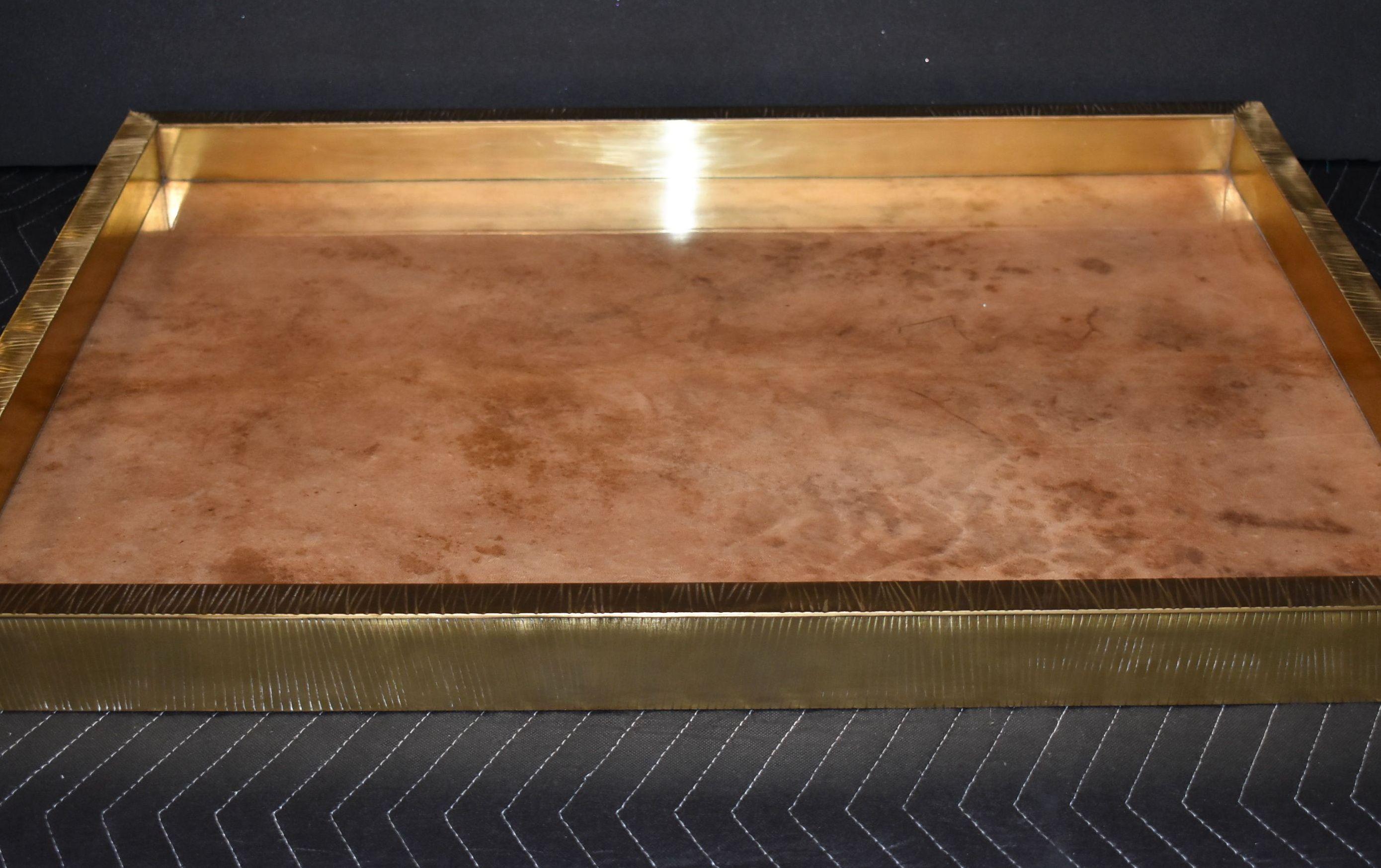 Brass polished trim cover with goatskin.
Parchment is in varying shades of darker and lighter brown beige color. High gloss polyester resin filled finish.
  