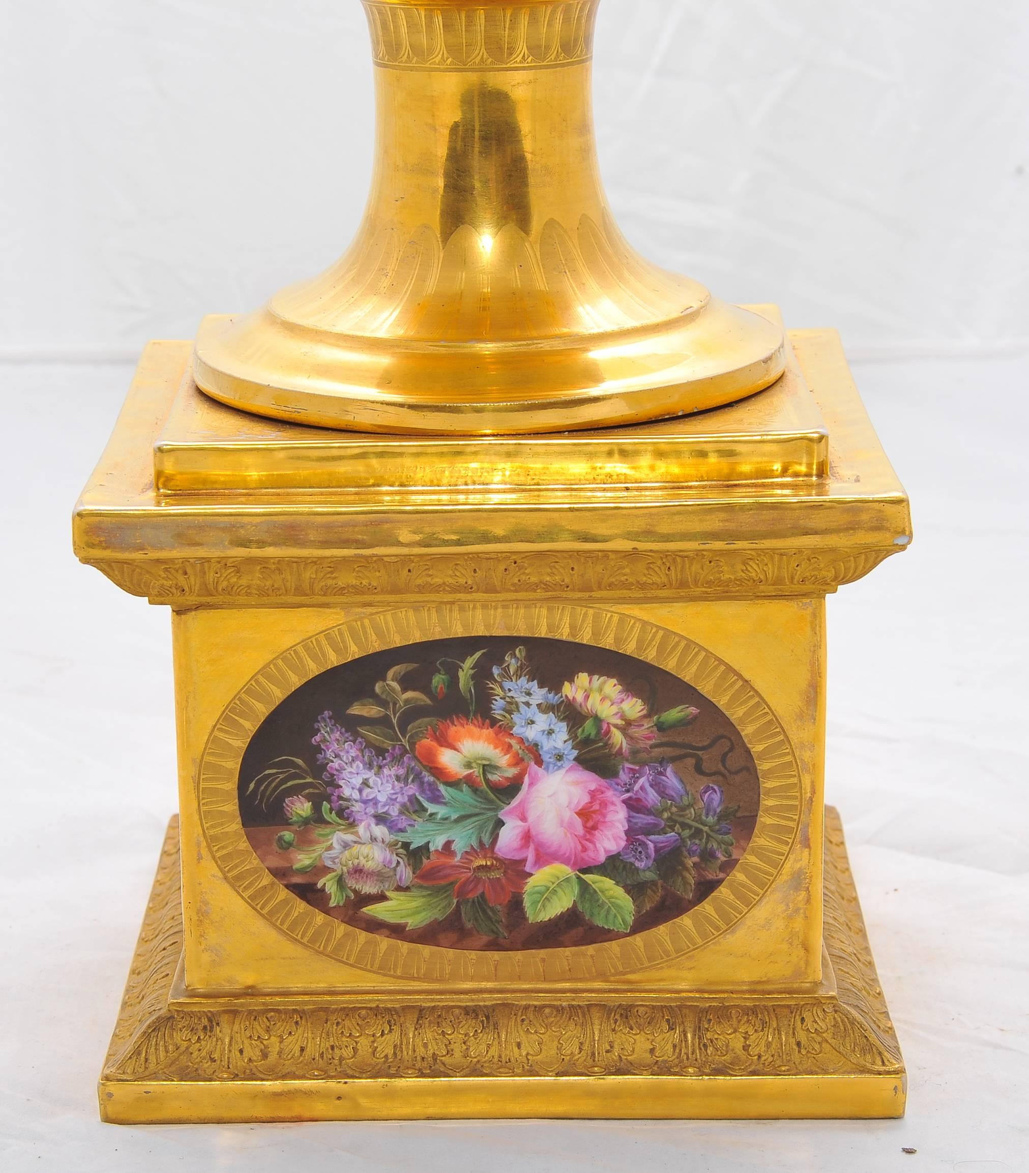 A very large and impressive fine quality 19th century, Paris porcelain vase on stand. Having wonderful gilded two-tone background, two scrolling handles each with inset plaques of cherubs riding on the backs of swans, terminating in Mercury form