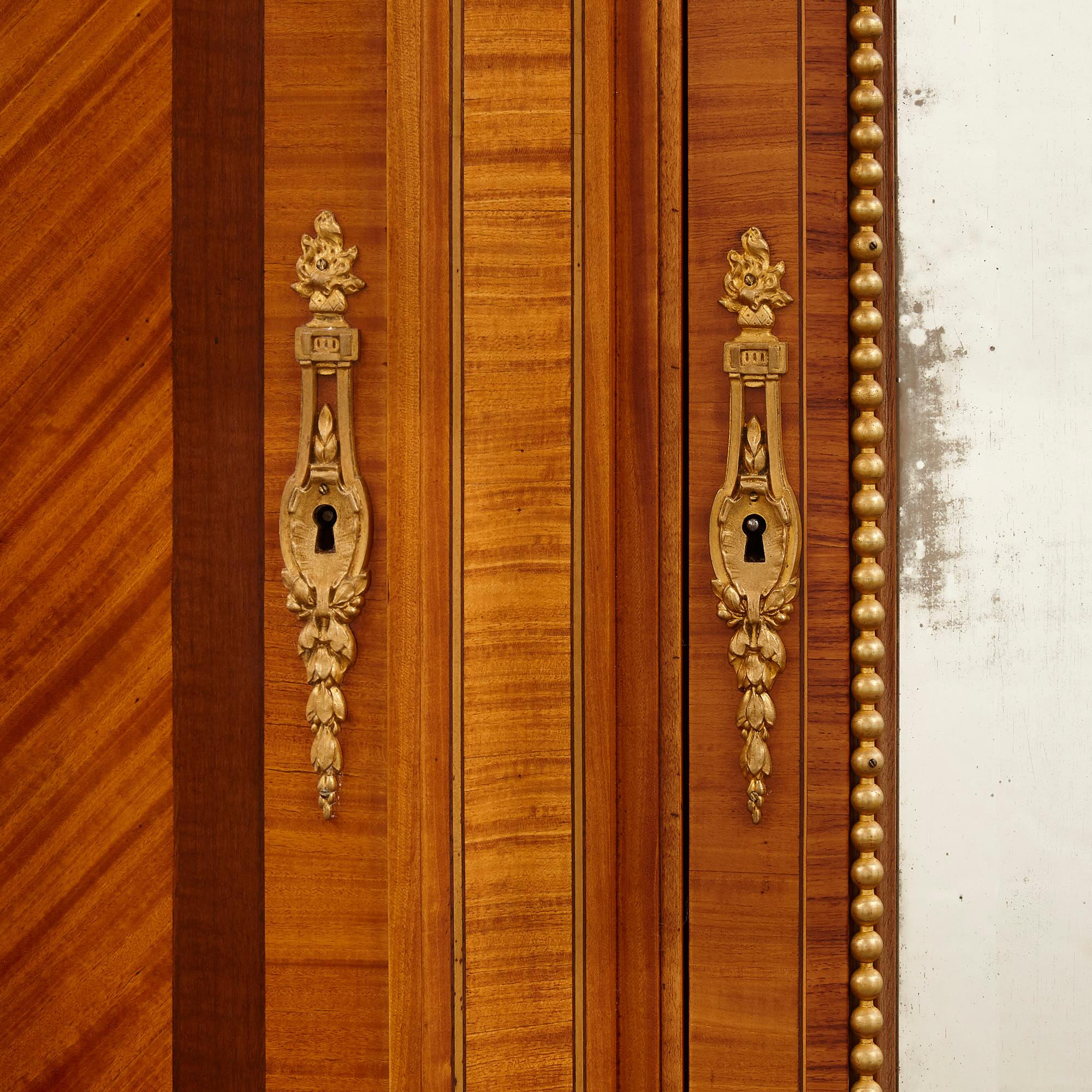 French Large Parisian Wardrobe Adorned with Marquetry and Gilt Bronze For Sale